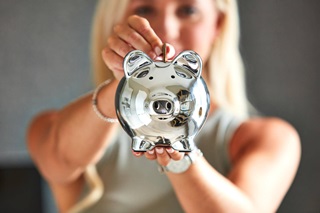 Woman holding piggy bank