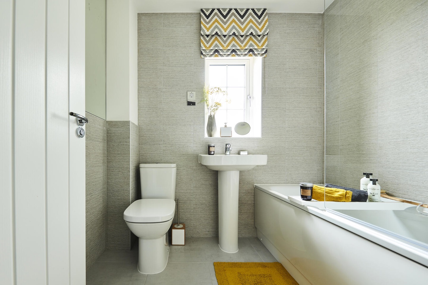 Toilet, sink and bath in bathroom