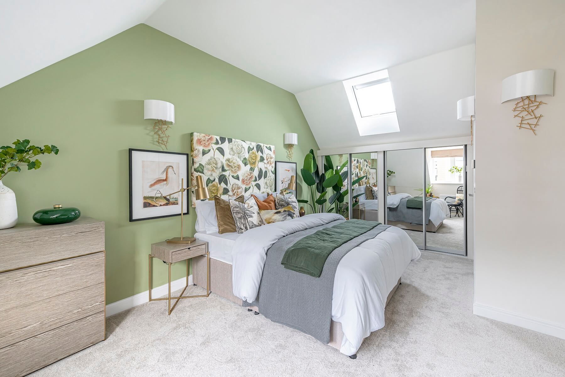 The main bedroom is spread across a whole floor and features an en suite