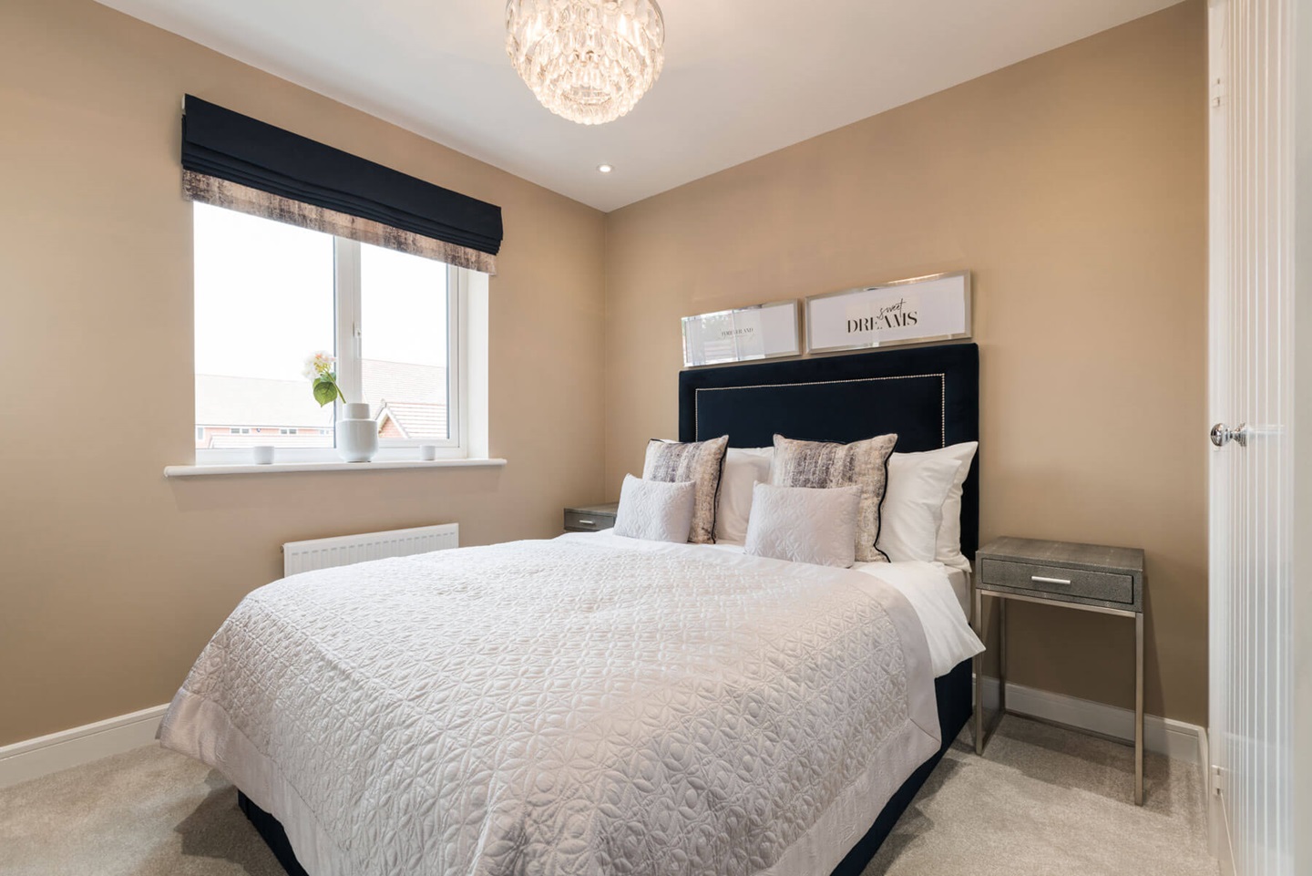 The second double bedroom welcomes plenty of natural light