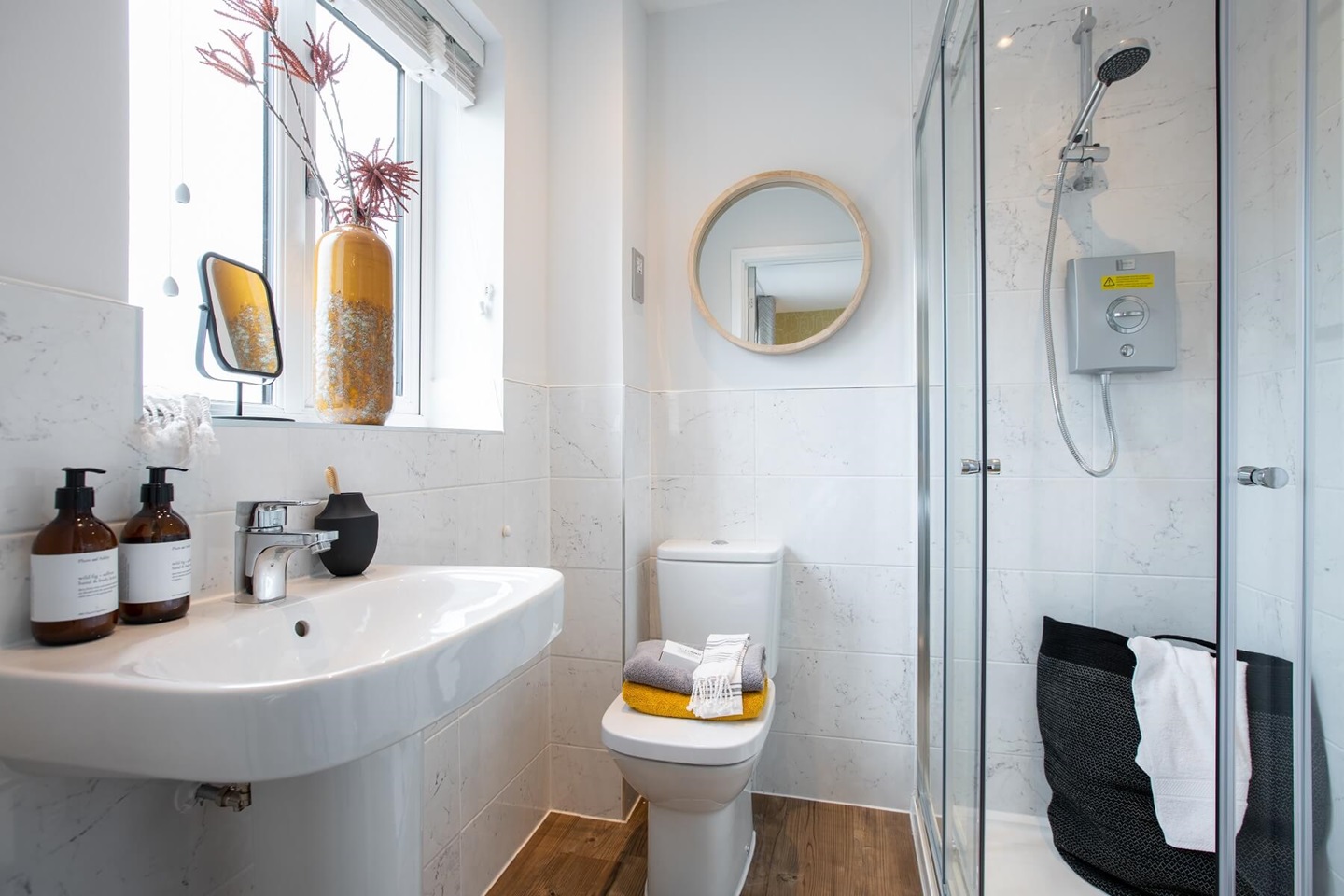 The main bedroom features an en suite shower room for added luxury