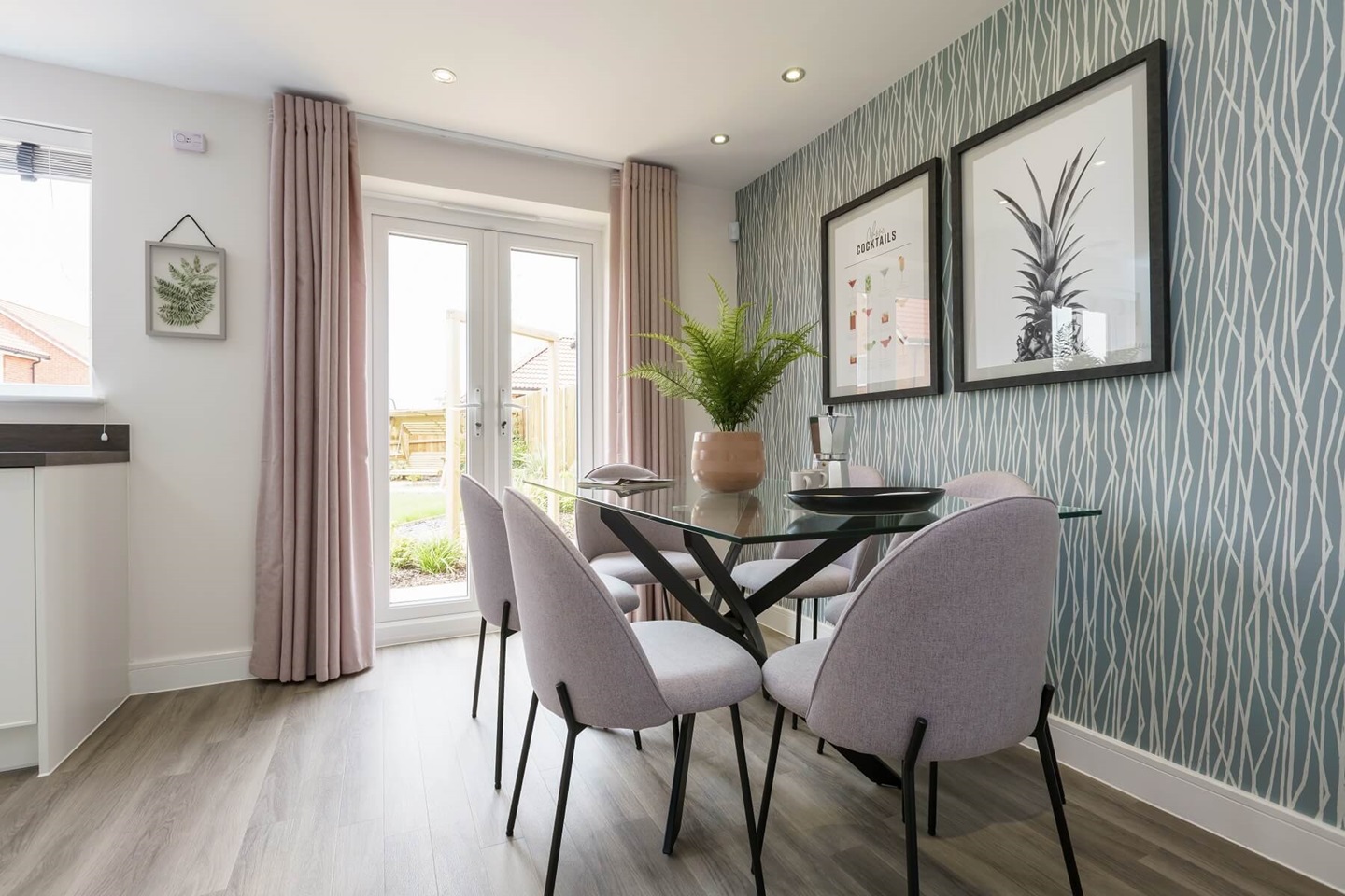 The dining area boasts double doors out to the garden