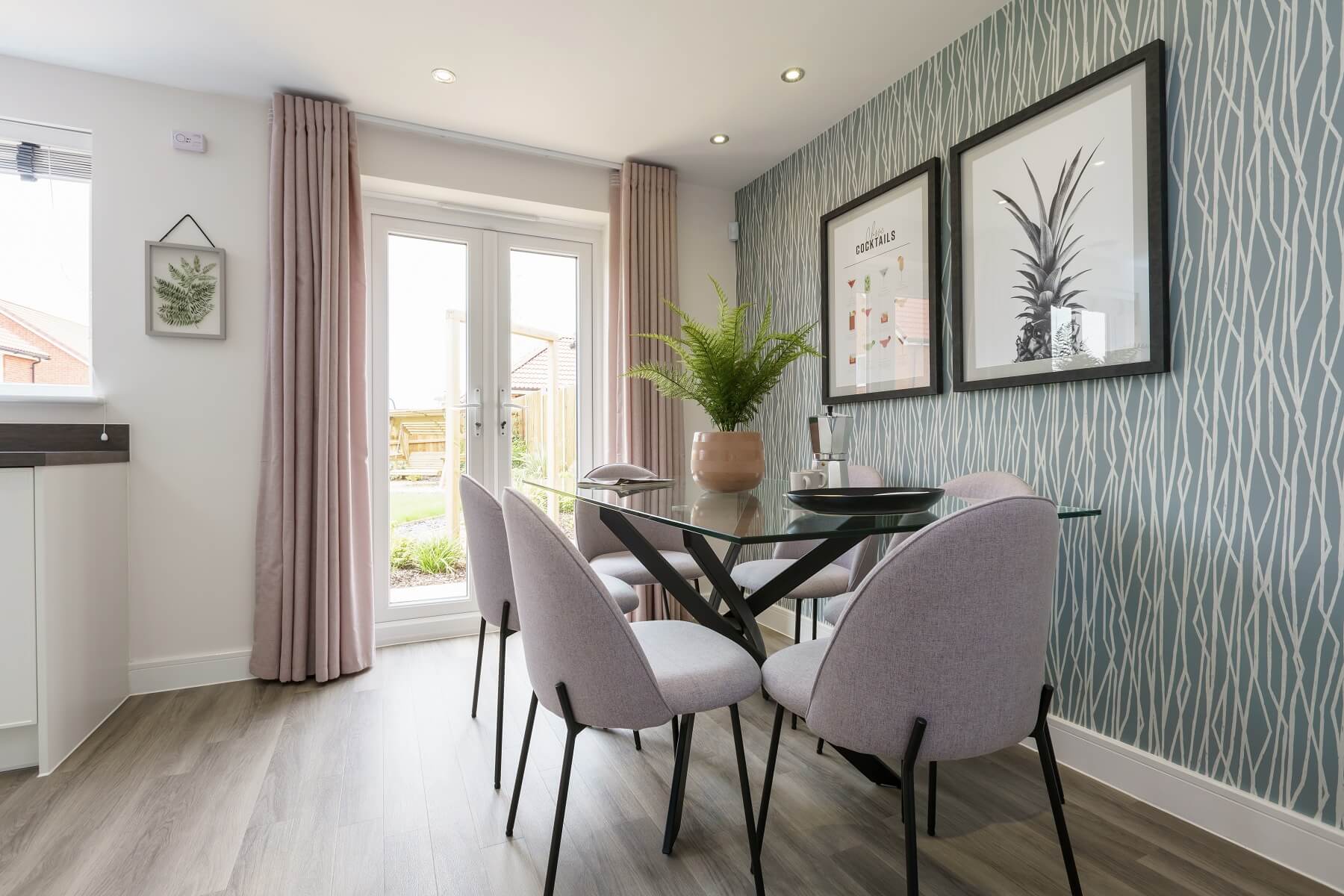 The dining area boasts double doors out to the garden