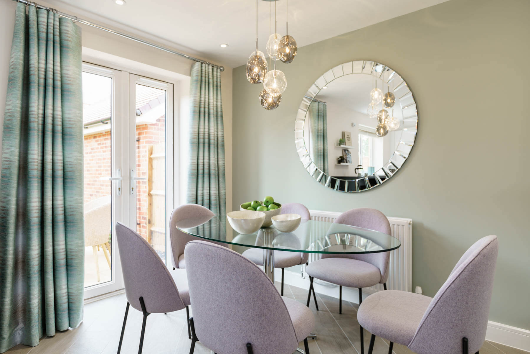 The dining area leads out through double doors to the garden