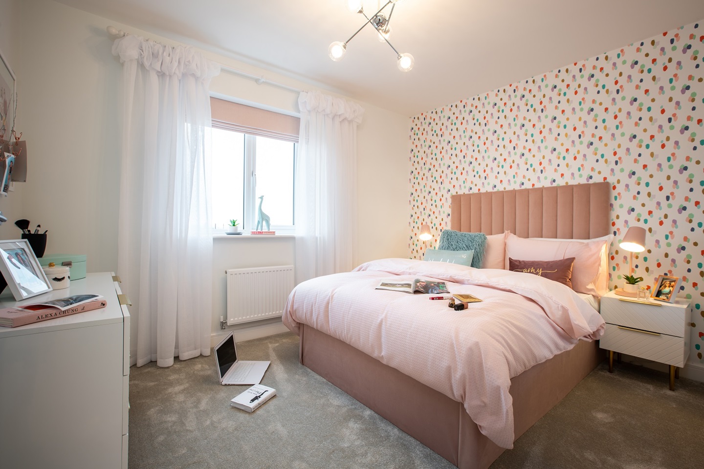 The fourth bedroom offers a light and airy space to relax