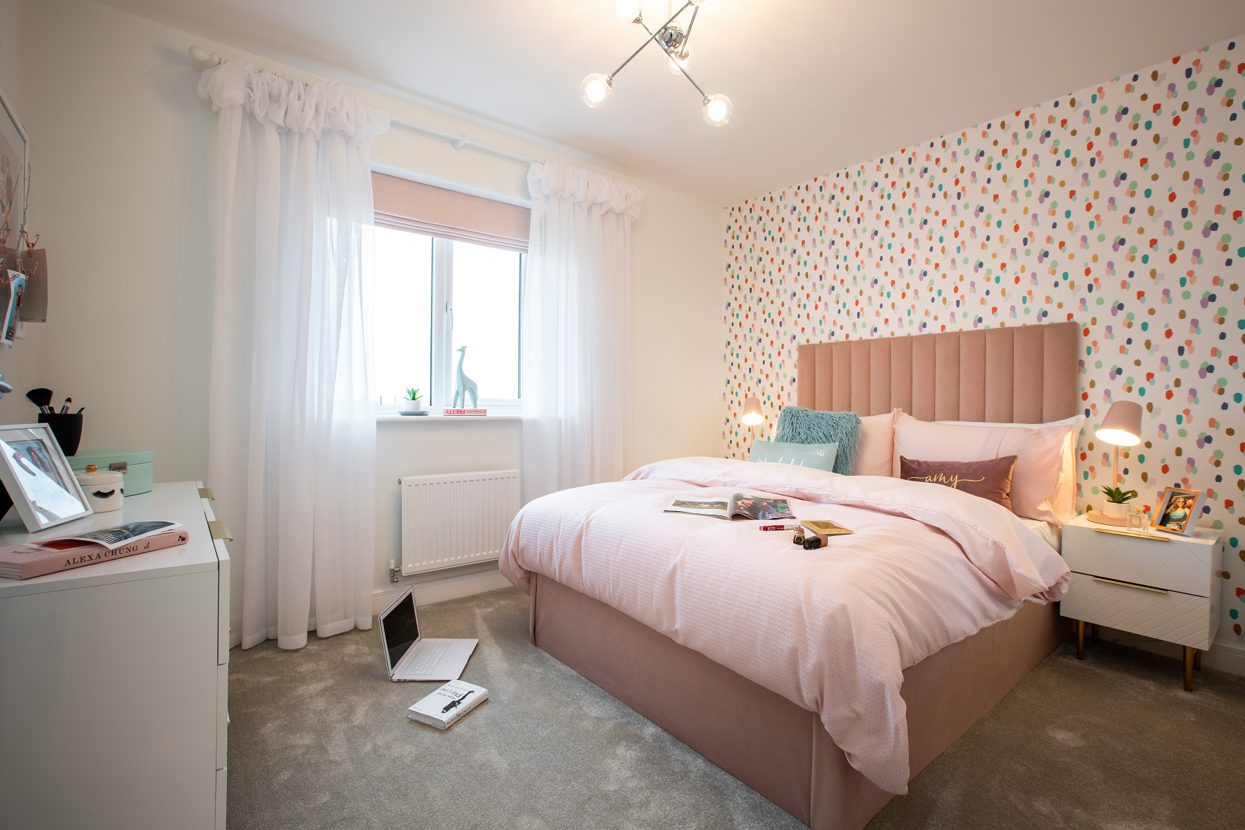 The fourth bedroom offers a light and airy space to relax