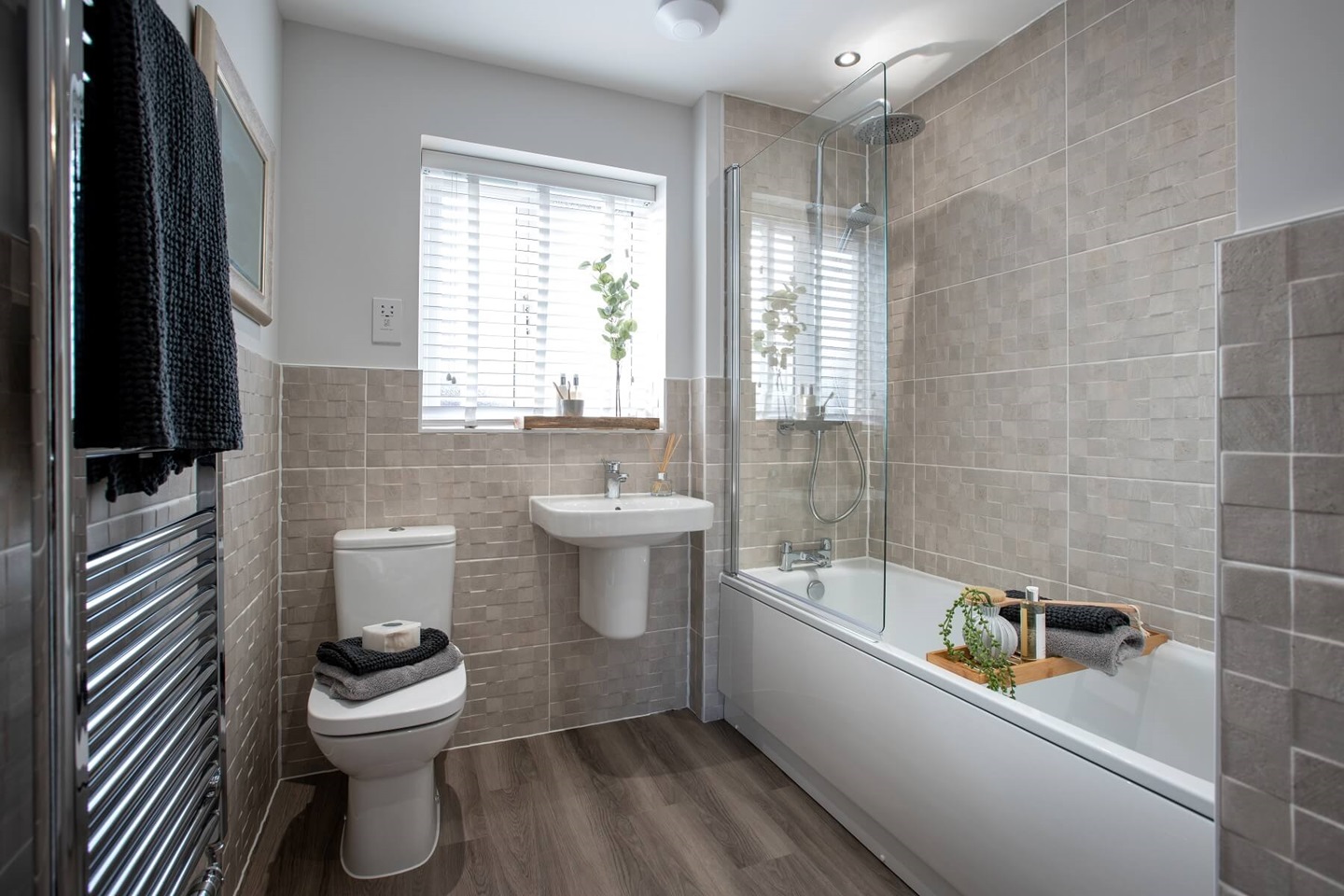 The main bathroom features high quality fixtures and fittings
