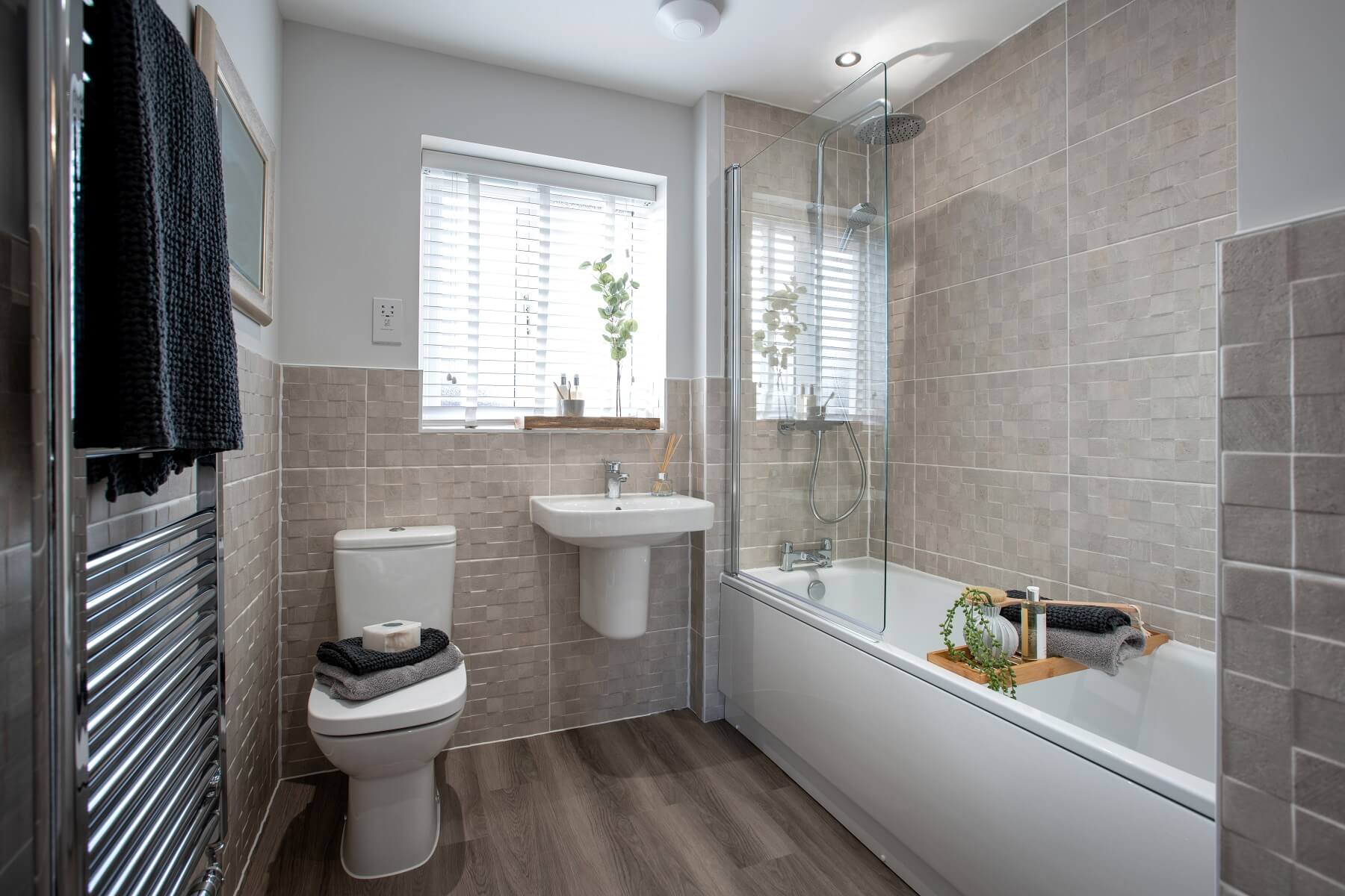 The main bathroom features high quality fixtures and fittings