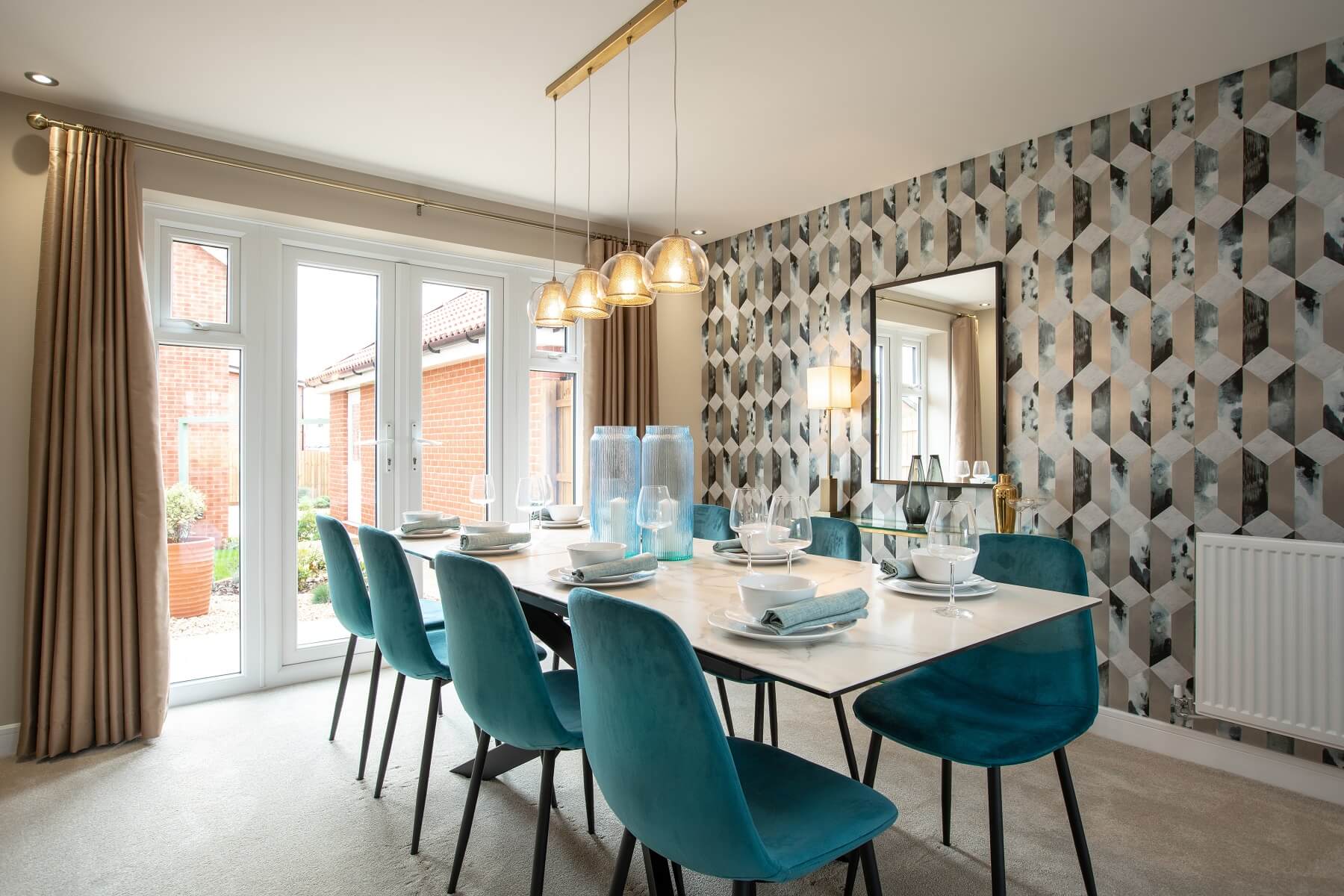 The light and airy dining area features double doors out to the garden