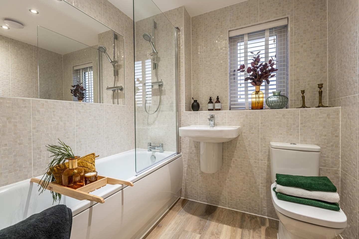 The main bathroom features high quality fixtures and fittings