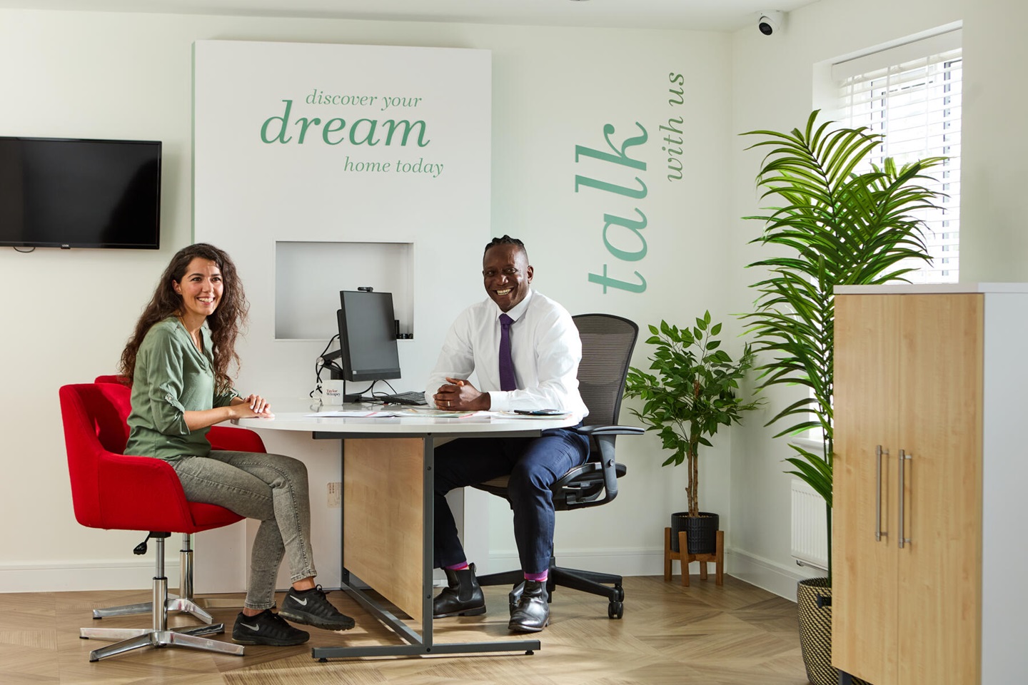 Taylor Wimpey staff with customer