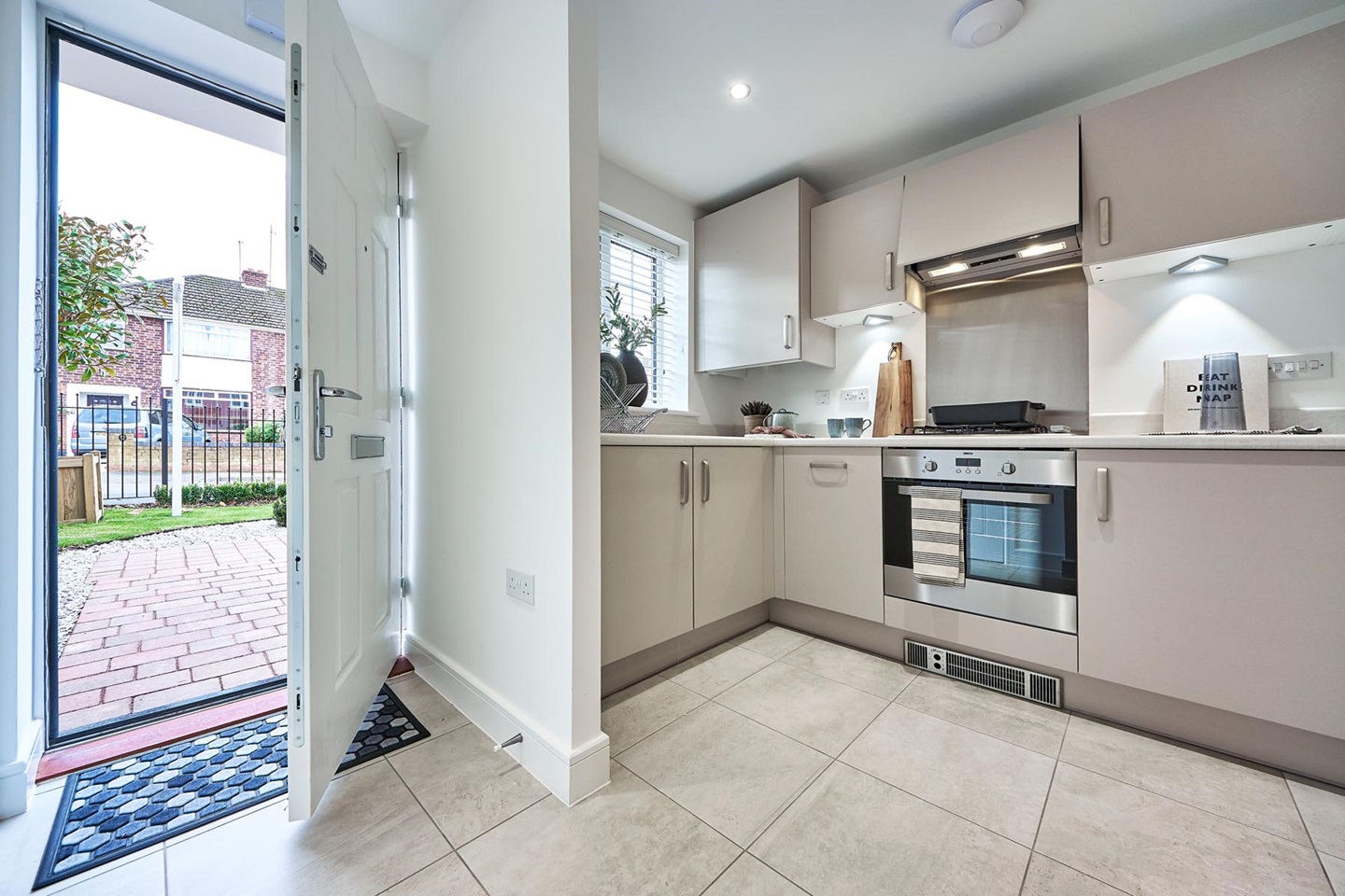 The modern fitted kitchen offers ample storage