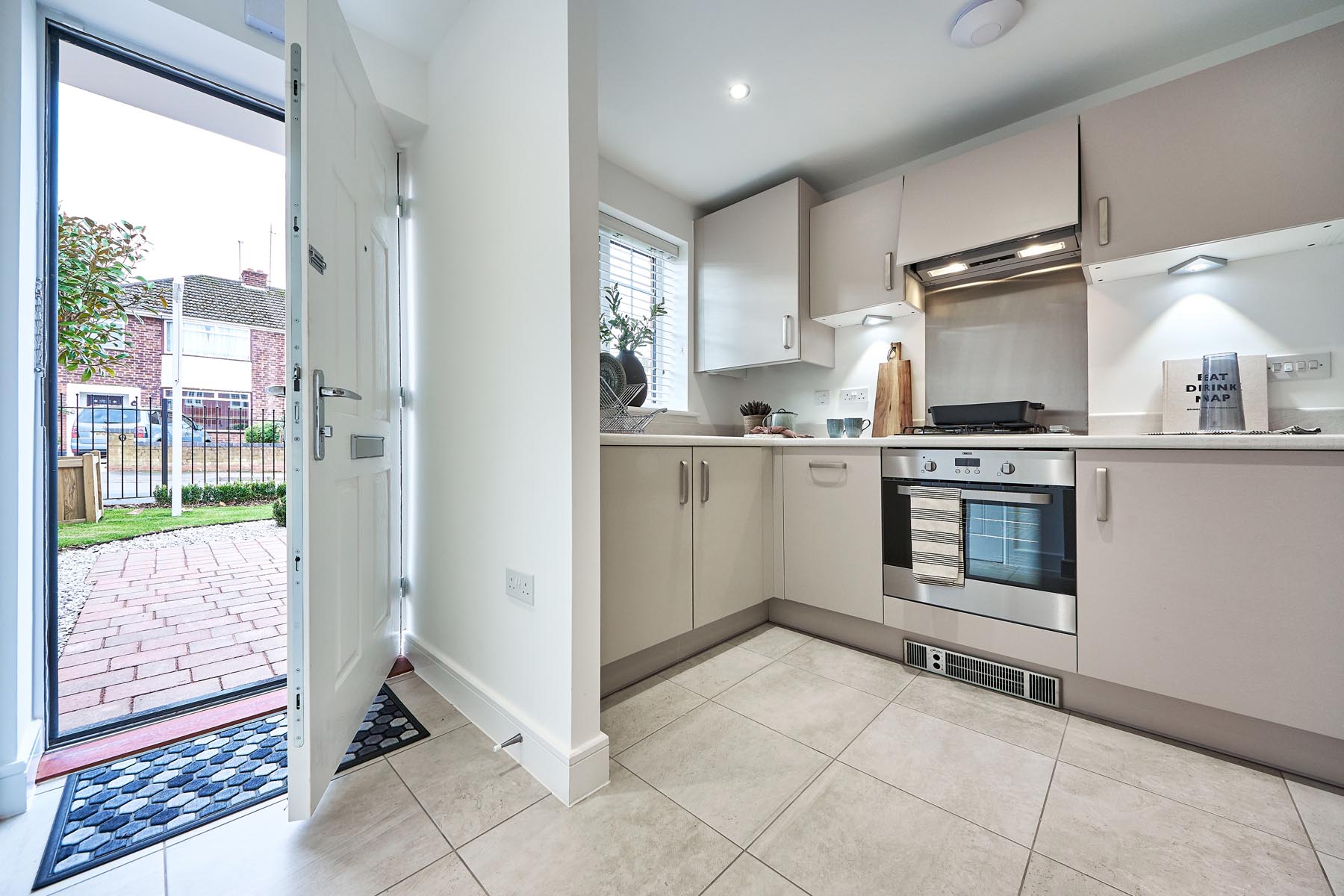 The modern fitted kitchen offers ample storage