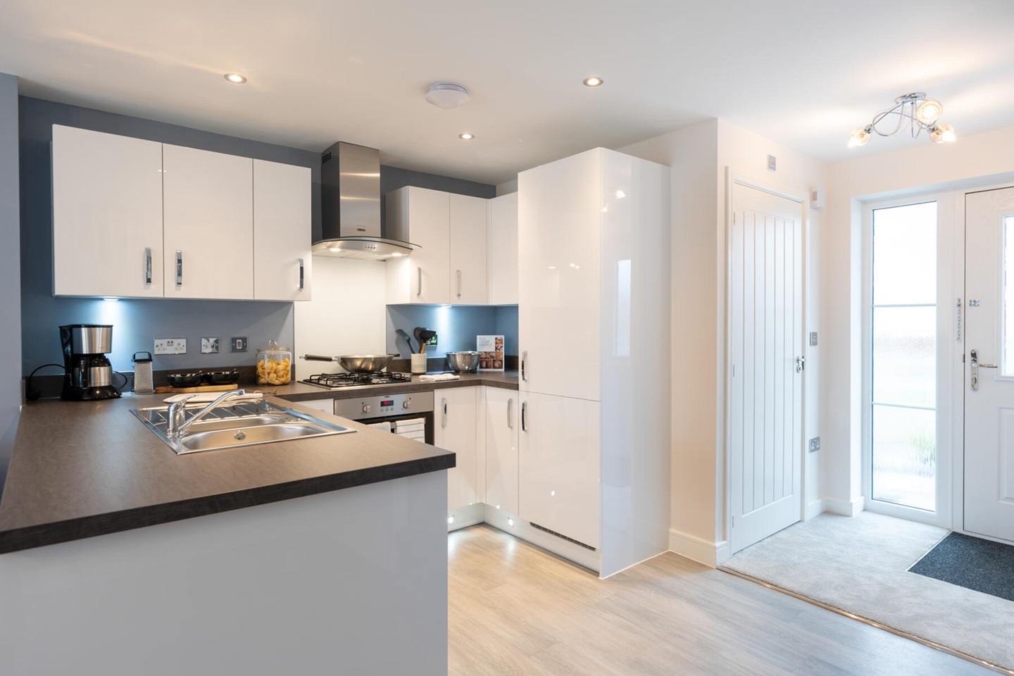 The kitchen benefits from ample storage space