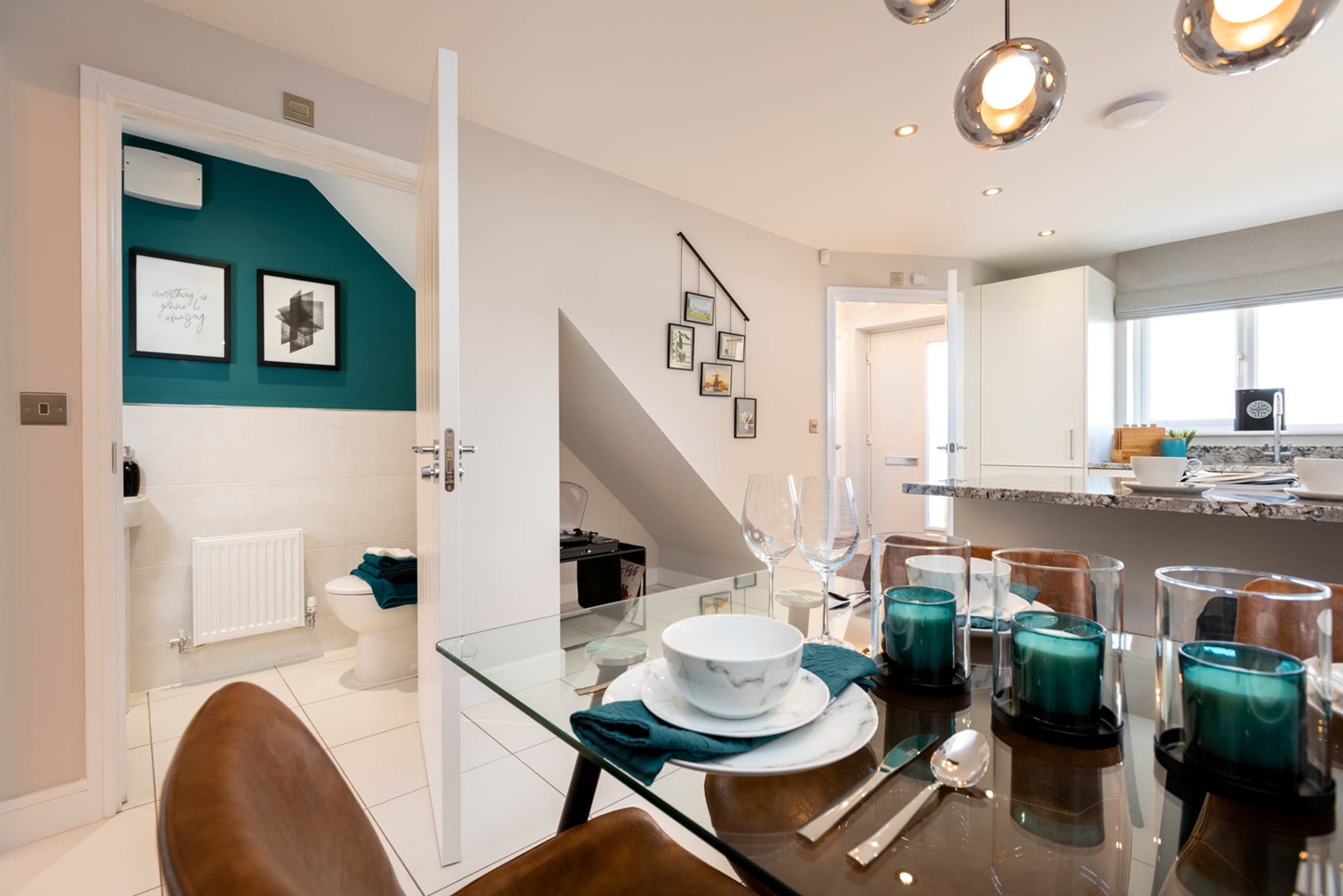 A handy downstairs bathroom is located off the dining area
