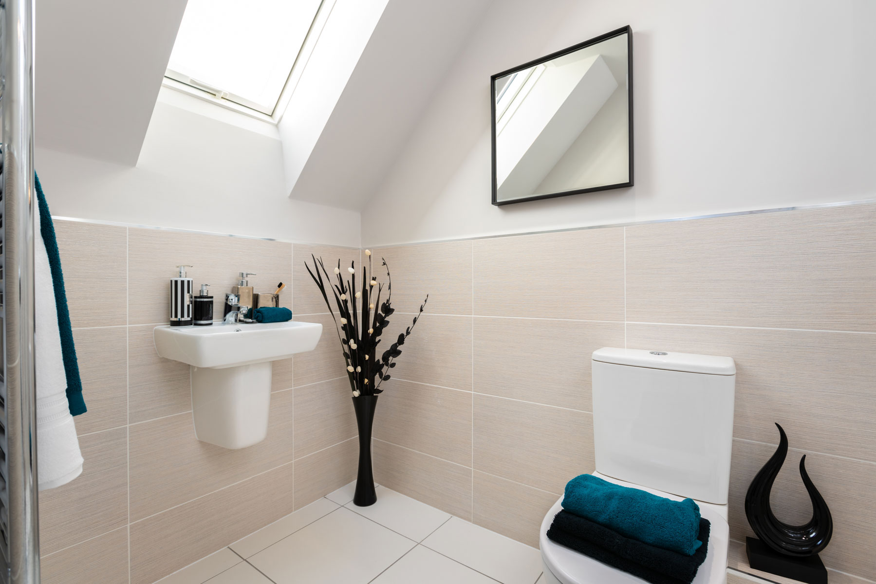 The en-suite bathroom is flooded with natural light