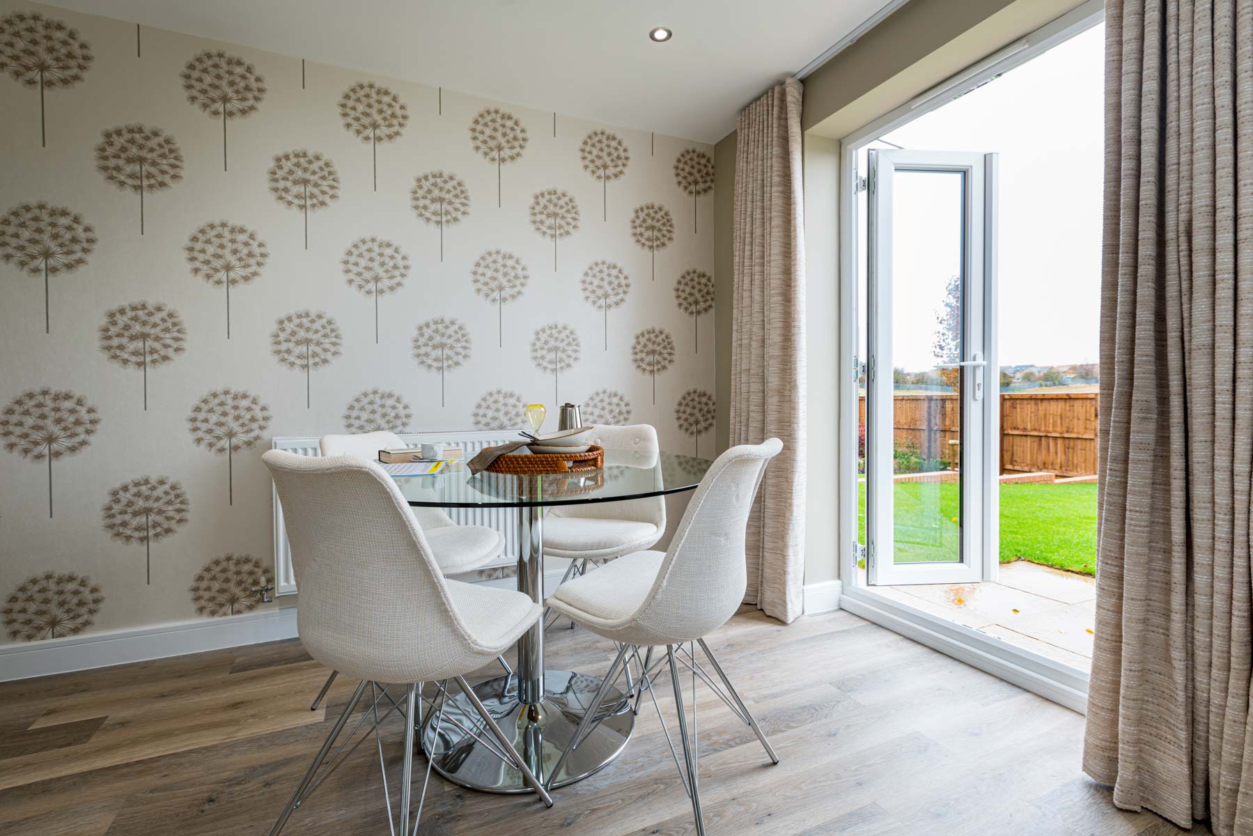 Double doors lead out to the garden from the dining area