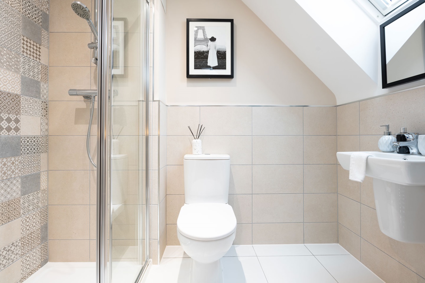 The en-suite features a large shower enclosure