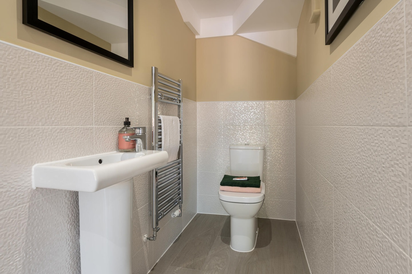 A convenient downstairs toilet sits in the centre of the home
