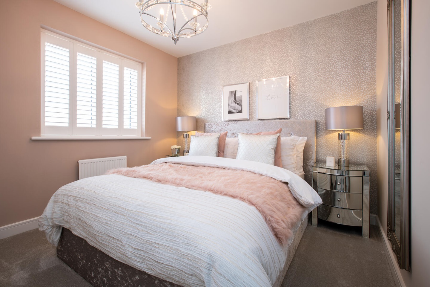 Large windows flood the main bedroom with light