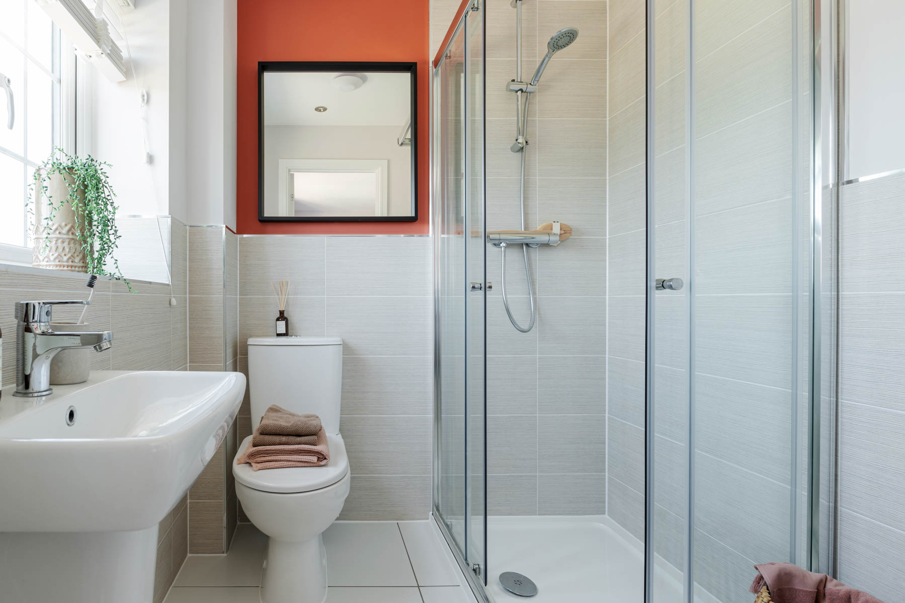 The en-suite is well proportioned and features a shower