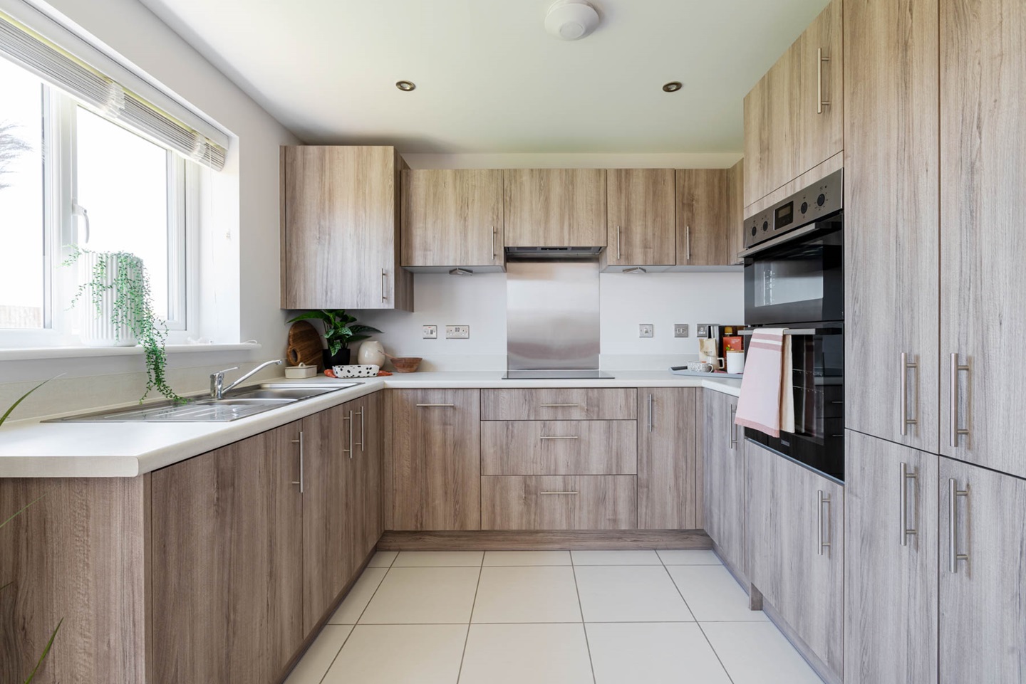 The kitchen benefits from ample storage