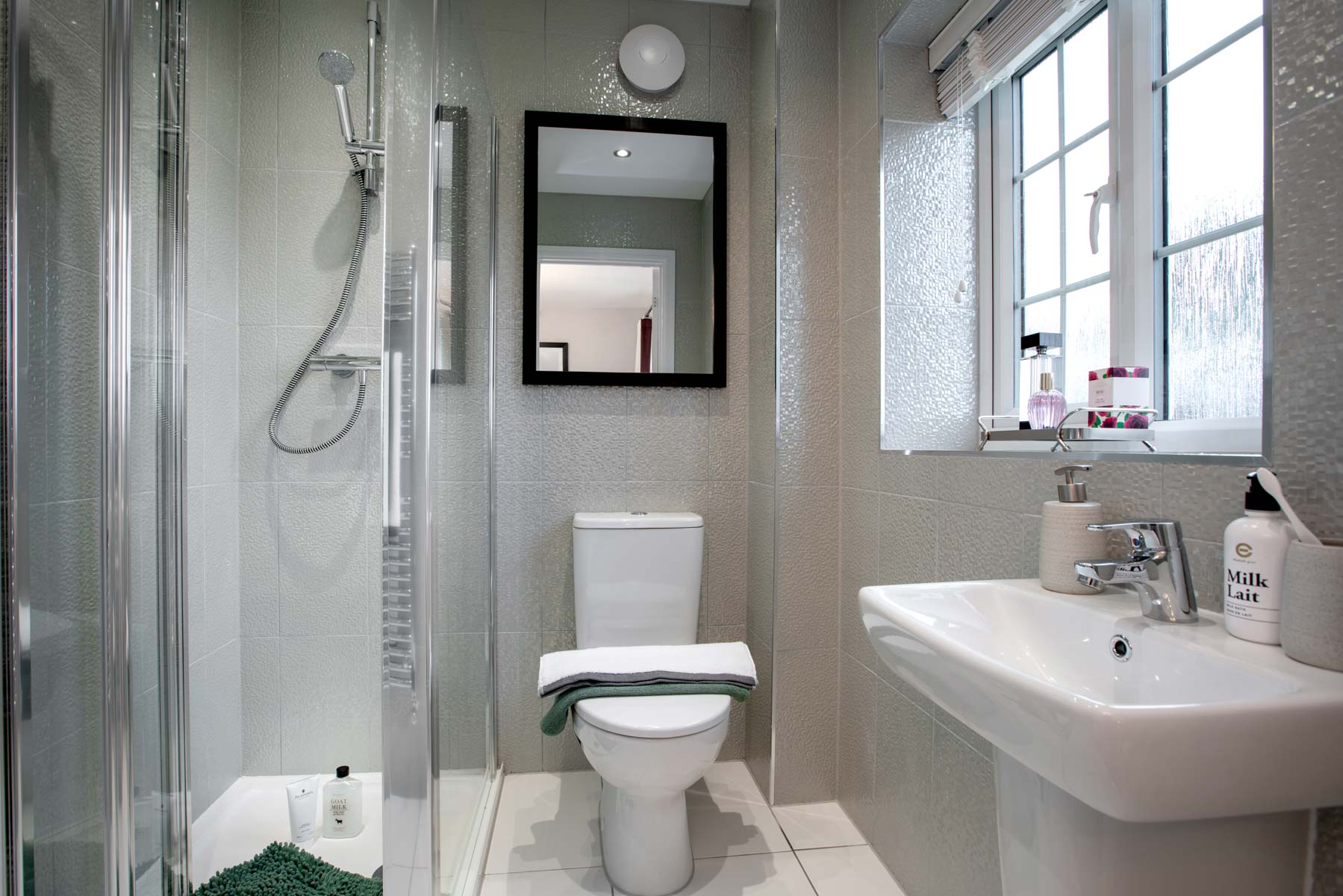 The en-suite is spacious and features a shower