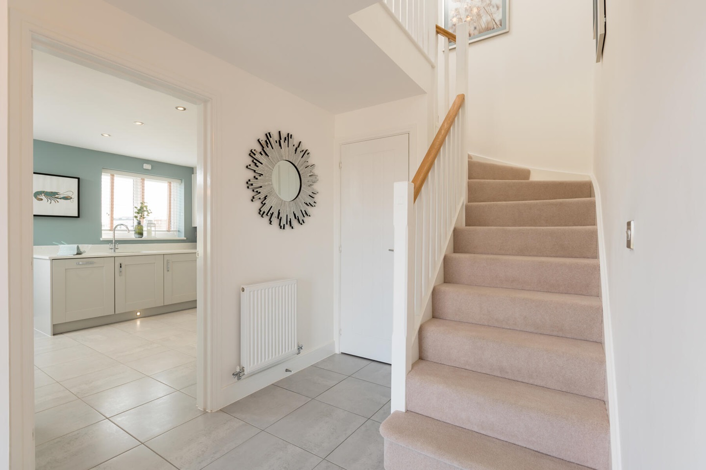 A spacious hallway leads to the kitchen and lounge