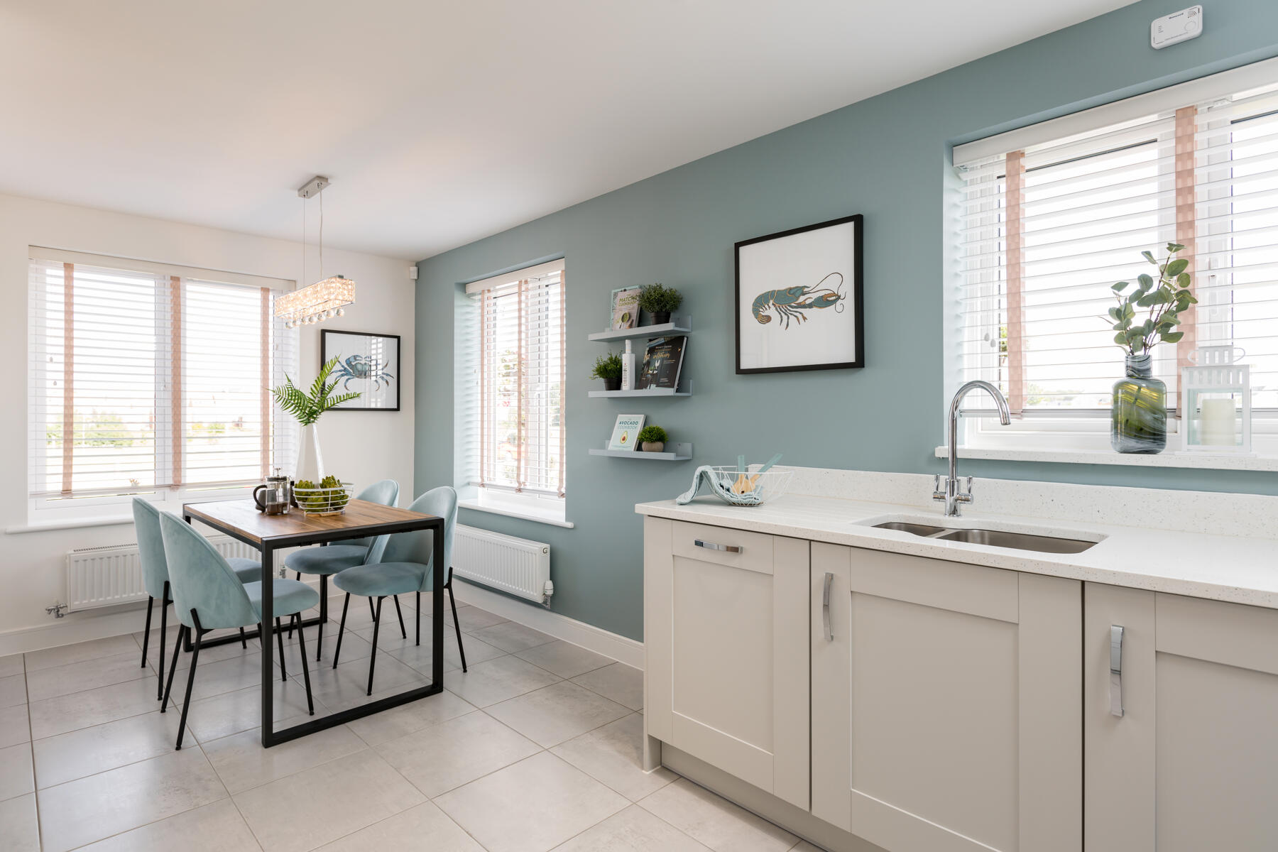 Large windows provide ample natural light to the kitchen