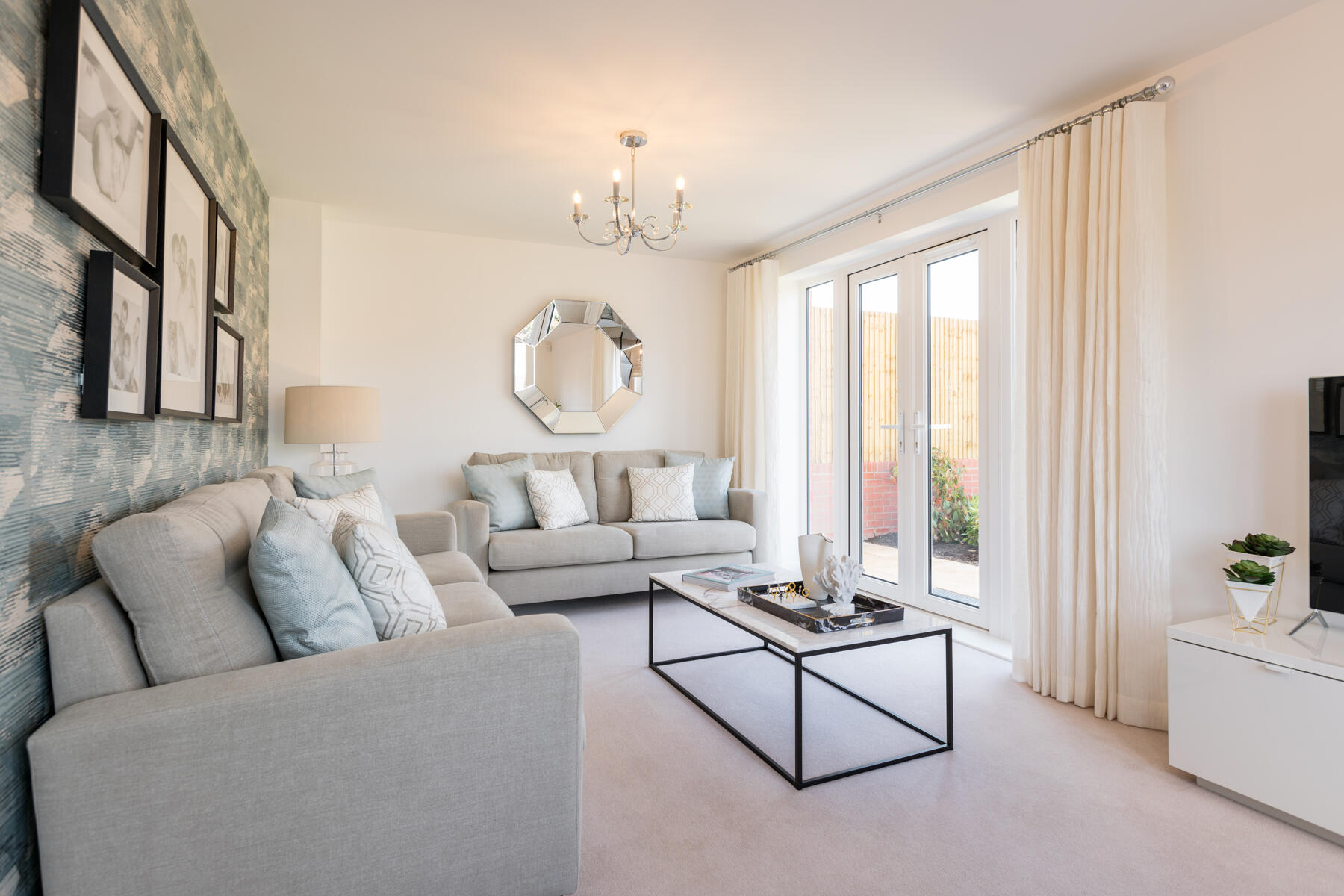Patio doors lead out from the lounge to the garden