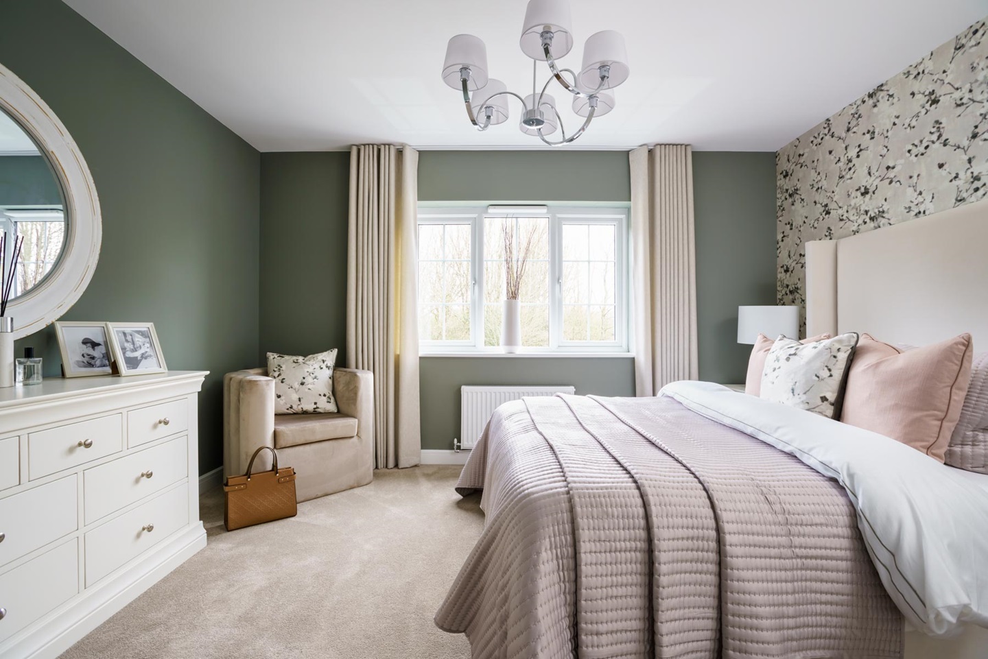Large windows flood Bedroom 1 with light