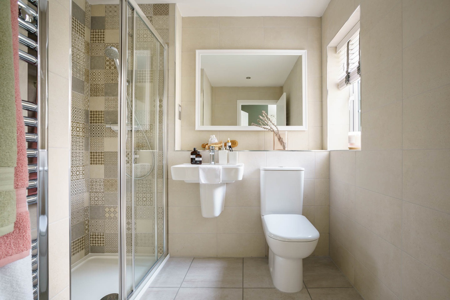The en-suite features a large double shower