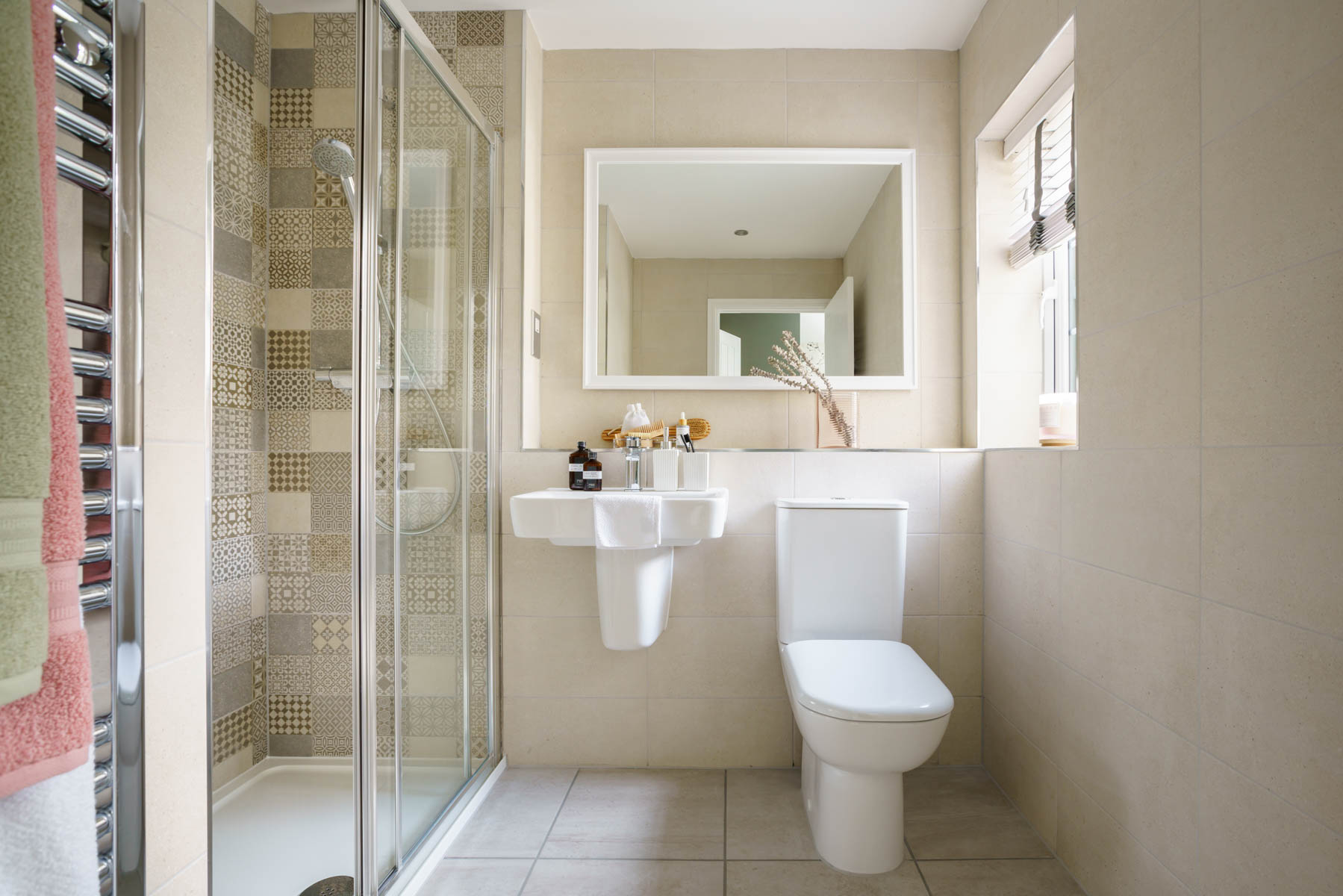 The en-suite features a large double shower