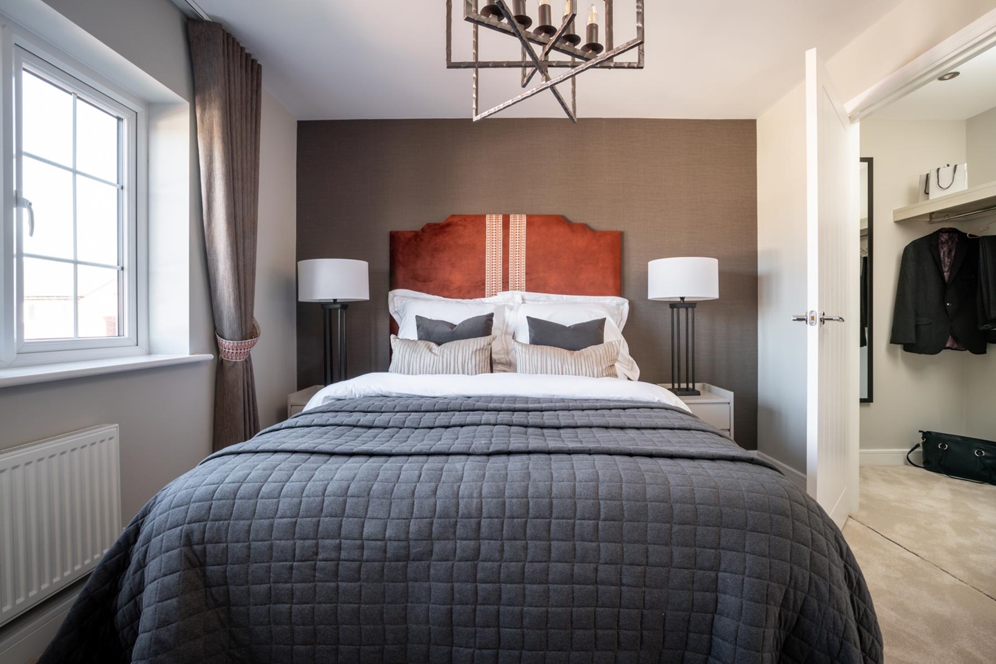 A walk in closet is an added asset to Bedroom 1