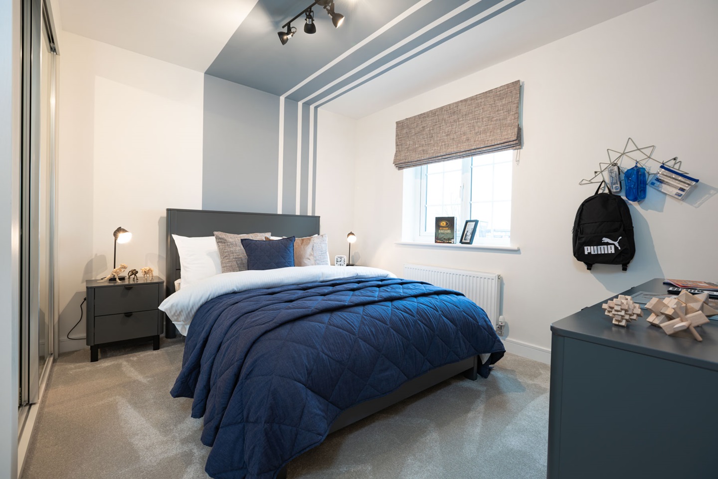 Bedroom 2 offers space for a double bed and storage