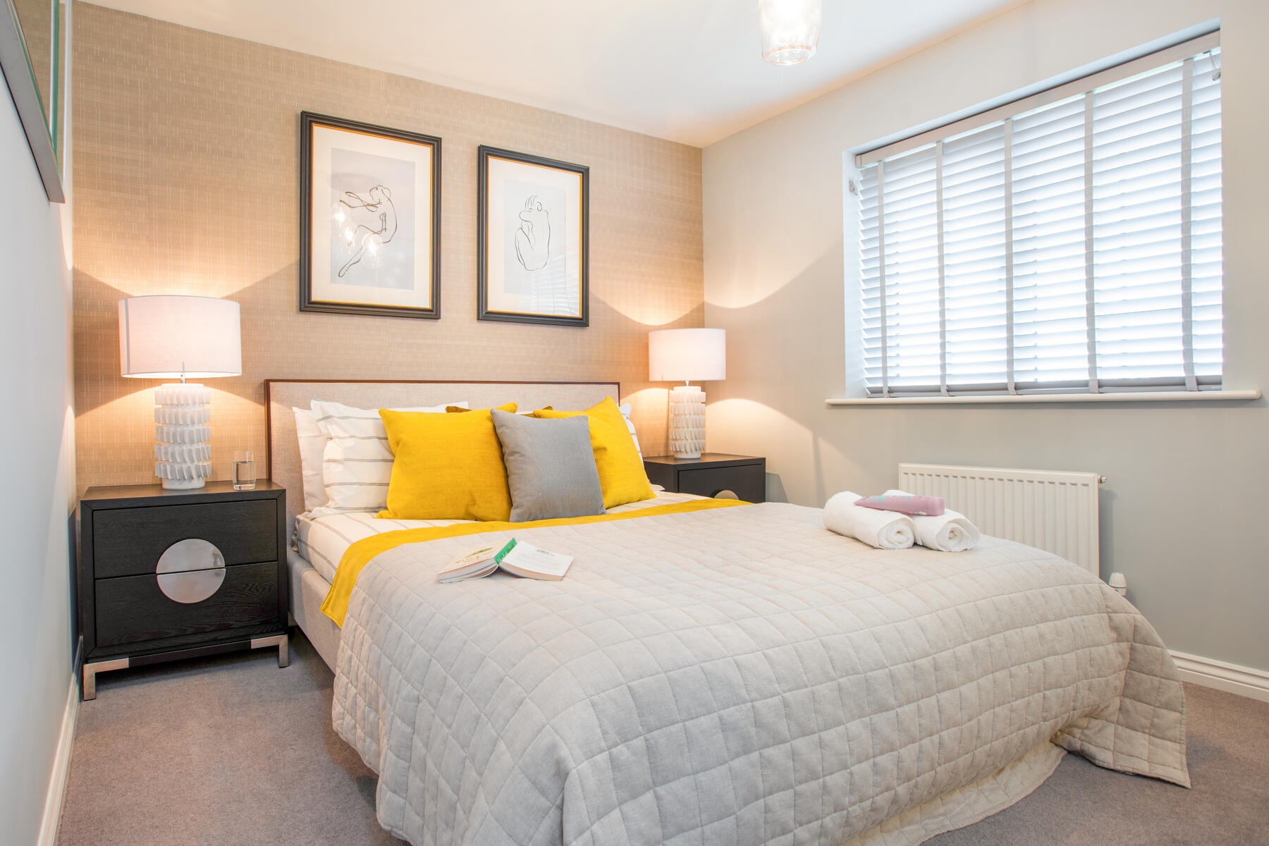 Large windows flood the second bedroom with light
