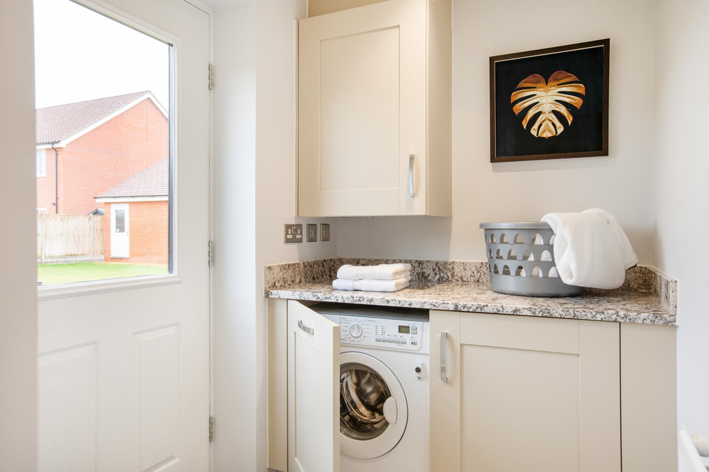 A handy utility room sits just off the kitchen