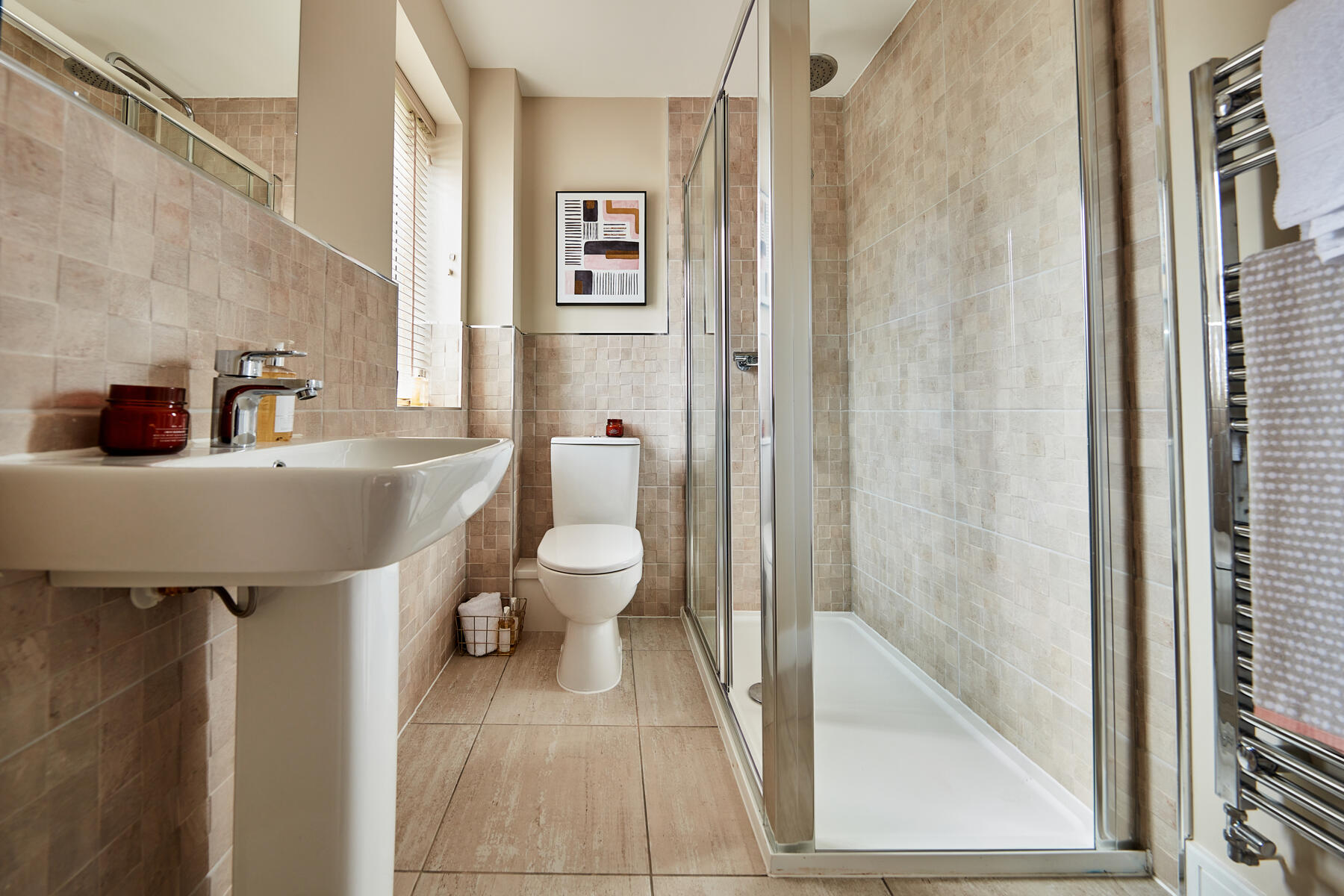 The en-suite features a large double shower