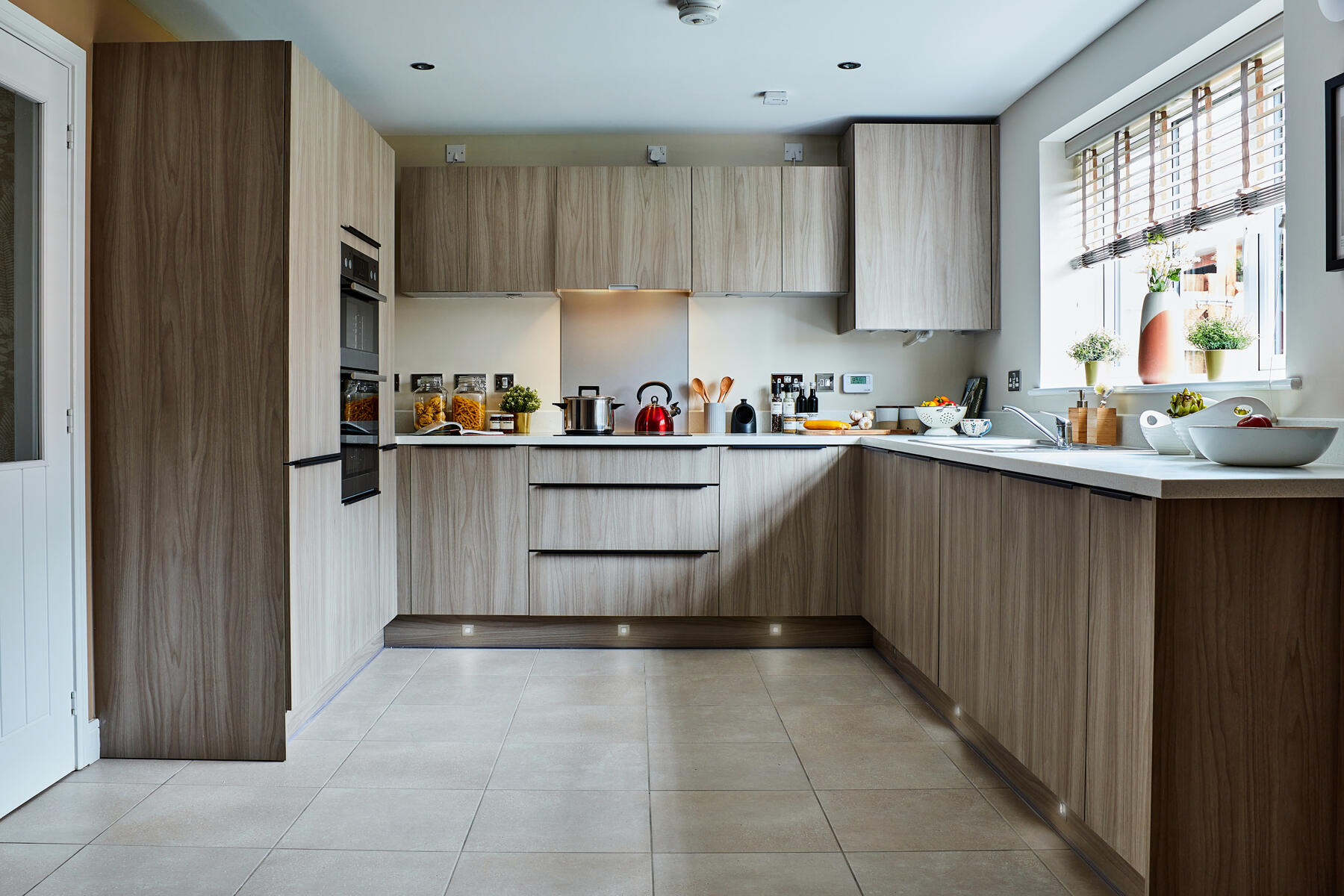 The modern kitchen features ample storage