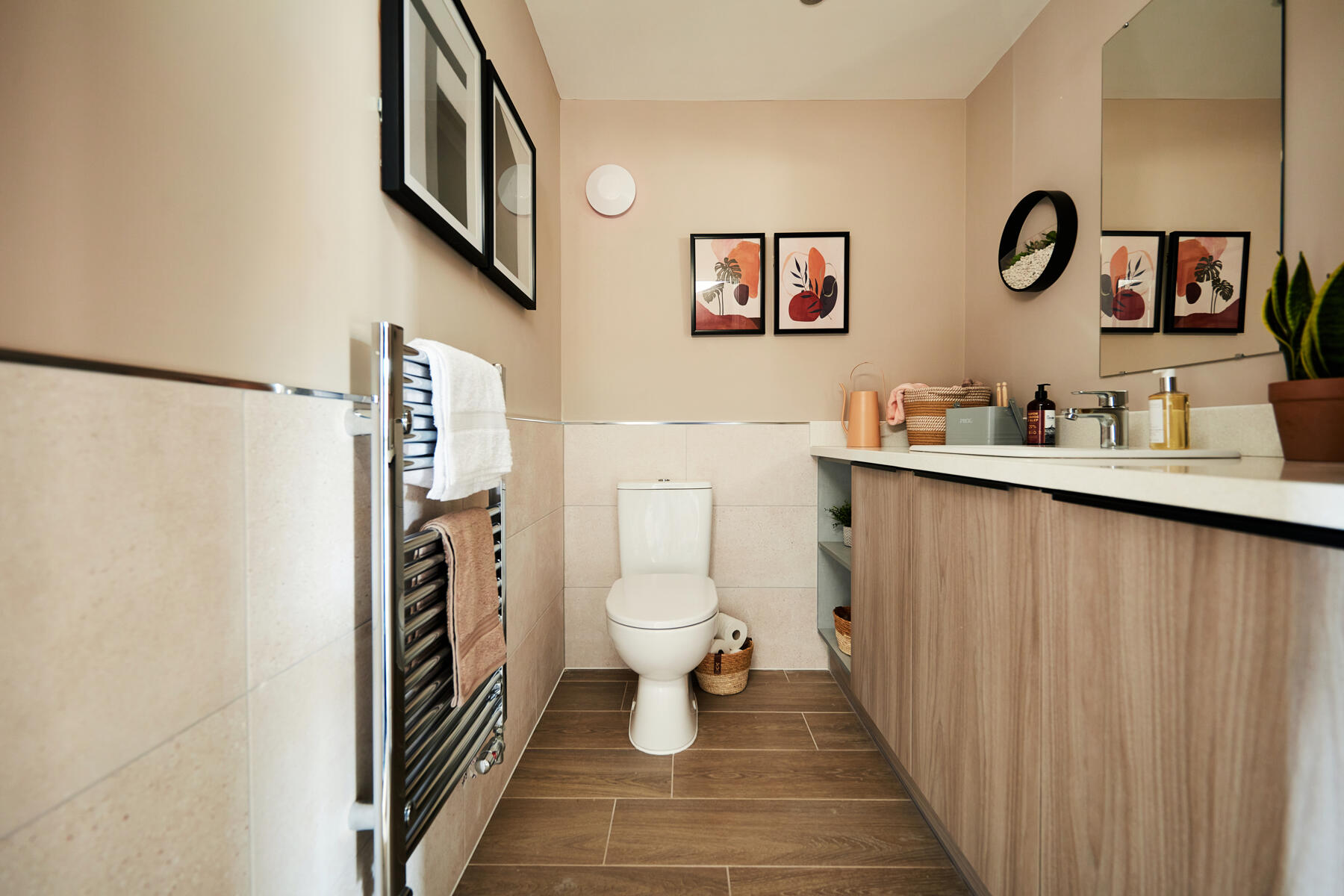 The downstairs toilet features utility space