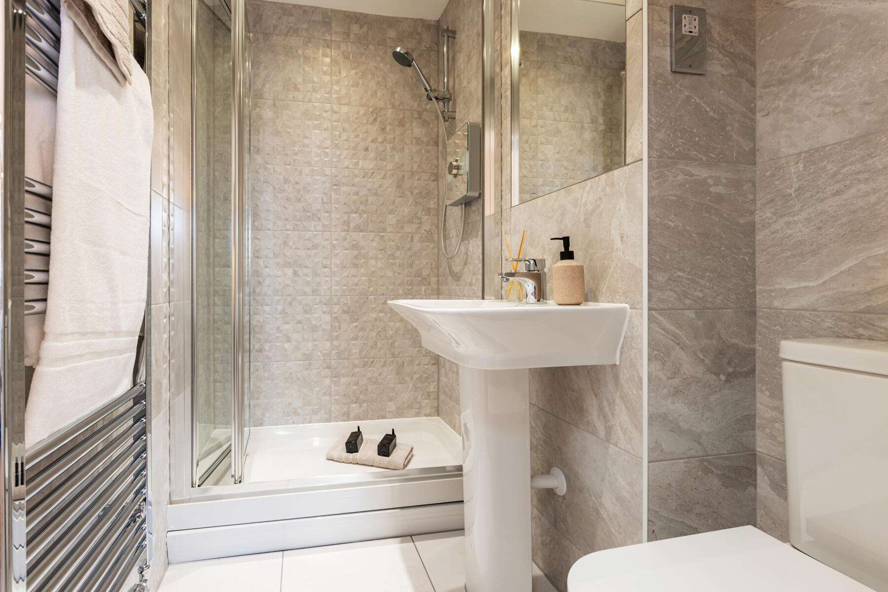 The en-suite features a double shower