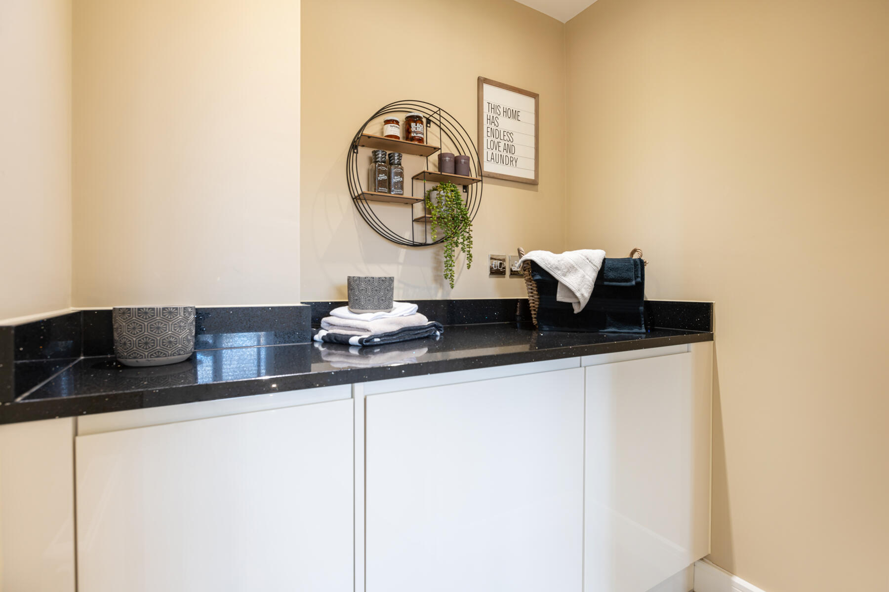 A handy utility rooms sits just off the kitchen