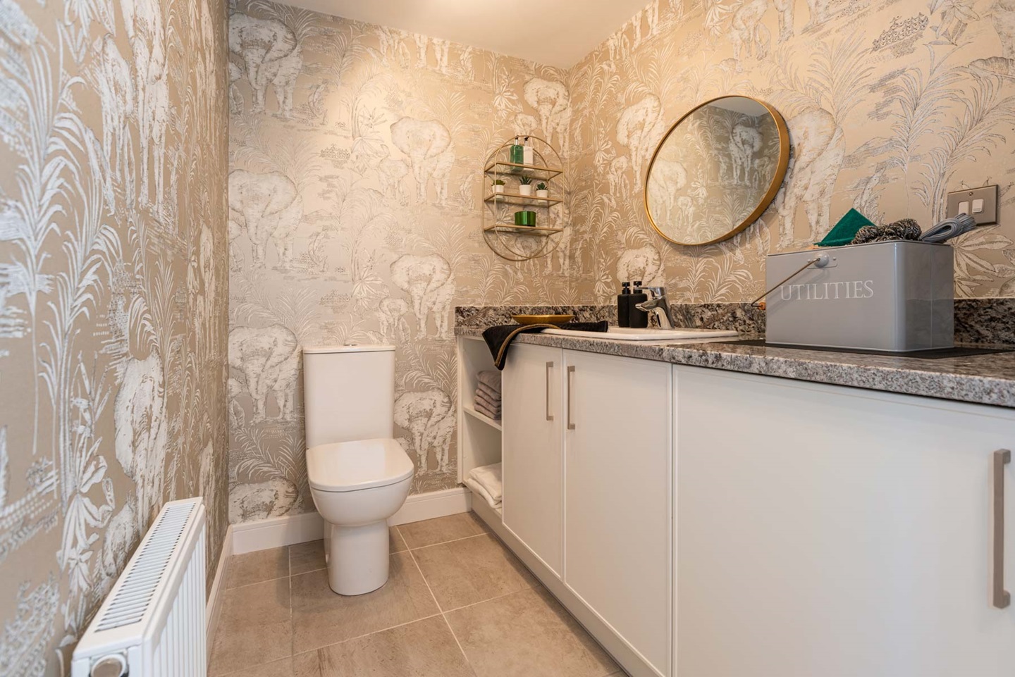 A combined laundry room and downstairs toilet
