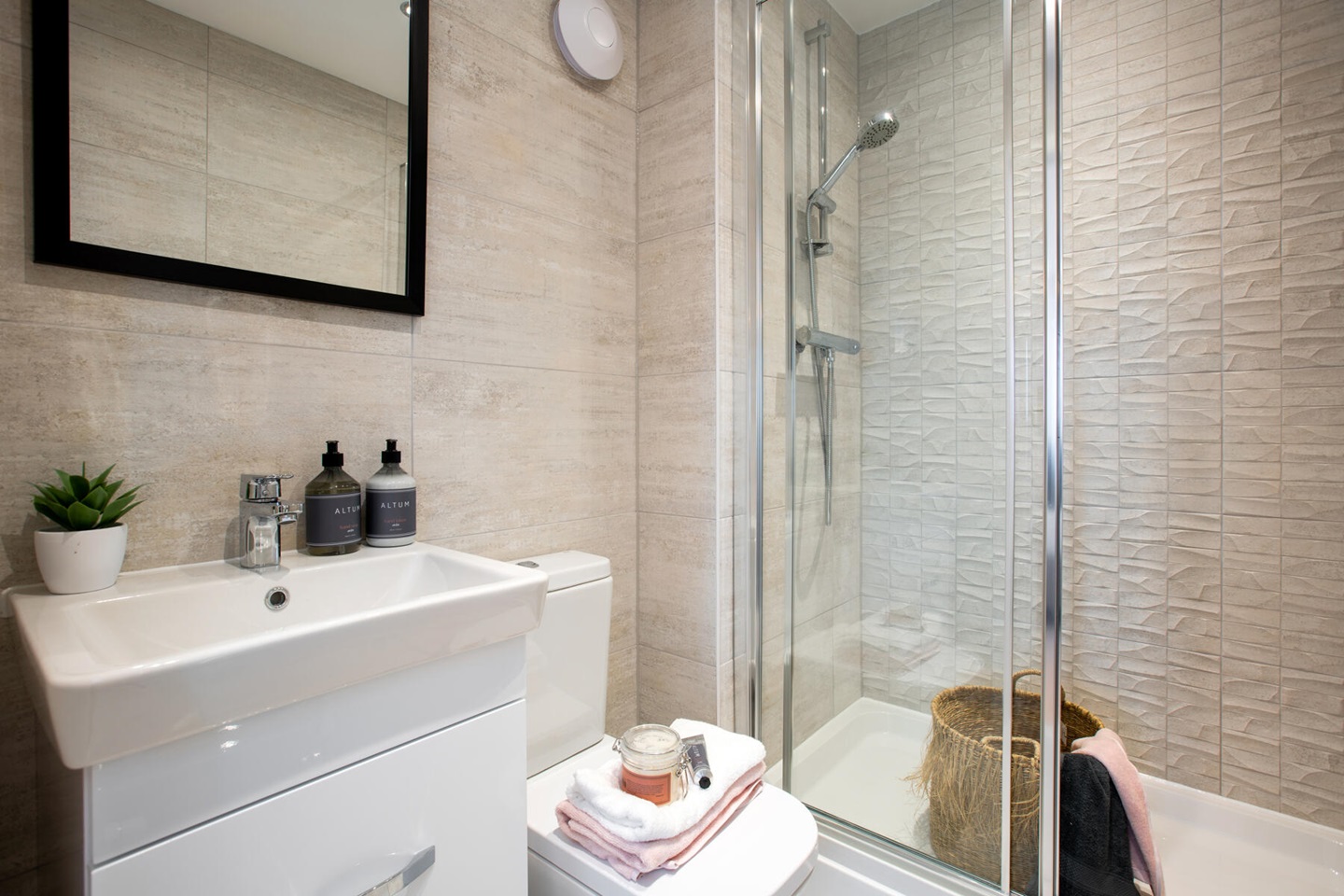 The en-suite benefits from a large double shower