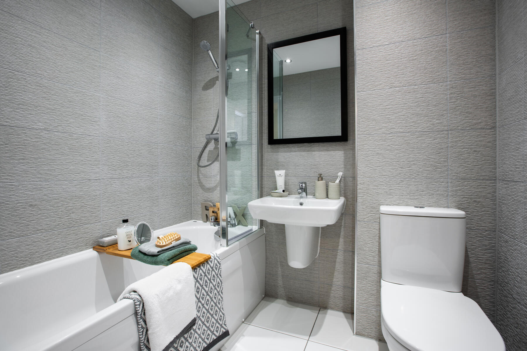 The bathroom includes a shower over the bath
