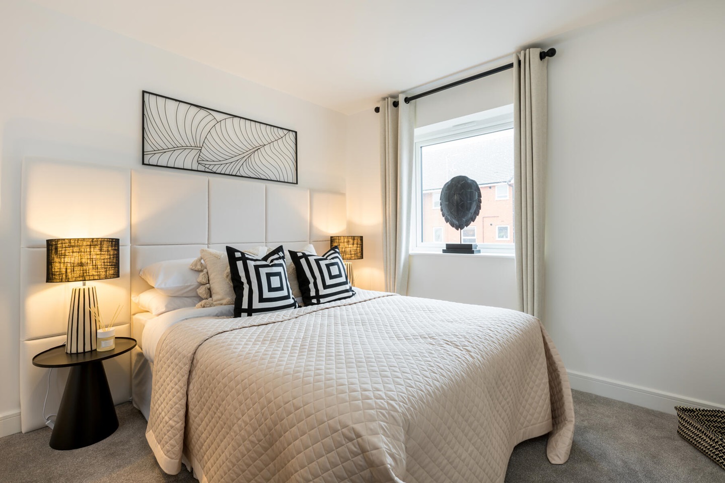 A second double bedroom includes plenty of space for storage