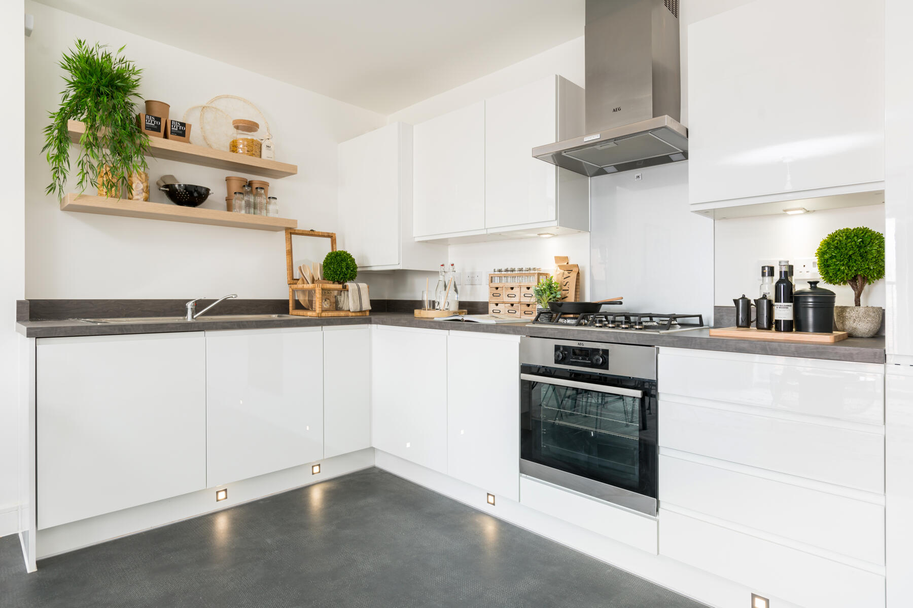 The modern kitchen features plenty of storage