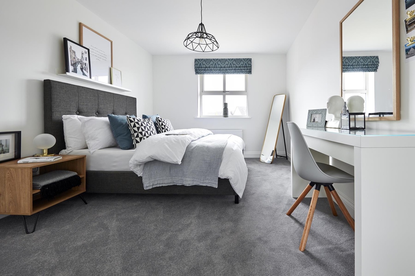 The spacious bedroom overlooks the front of the home