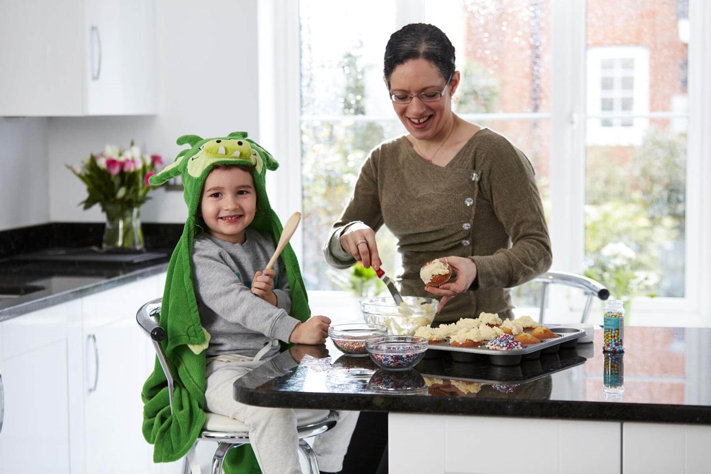 Mother and son baking in their new kitchen