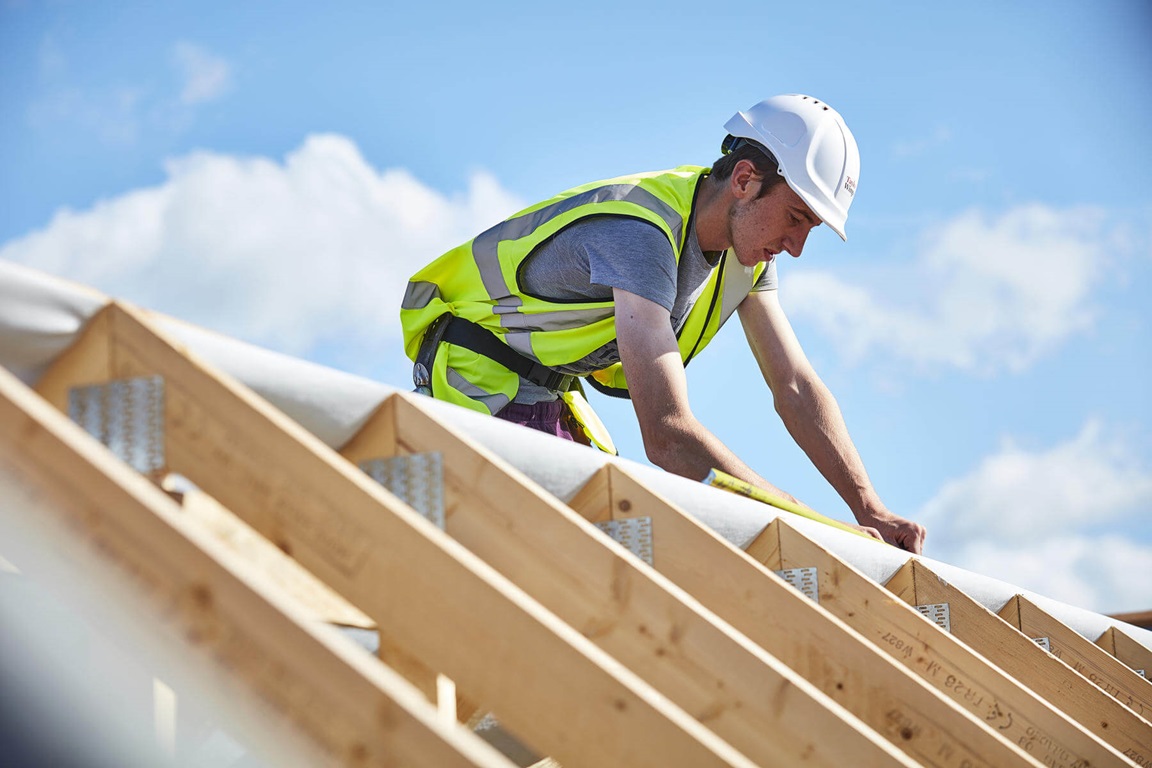 Construction staff building new roof